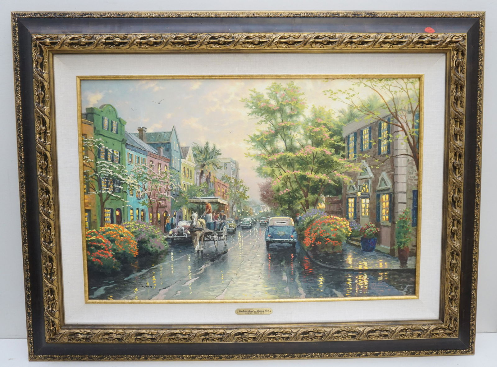THOMAS KINKADE CHARLESTON SUNSET ON RAINBOW ROW: Thomas Kinkade Limited Edition Studio Proof on Canvas "Charleston, Sunset on Rainbow Row". With COA. 81 of 860. Gallery Frame with Brass Plaque. Measures 28"x37"x2". Weight 11 pds. PROVENANCE: A Priva