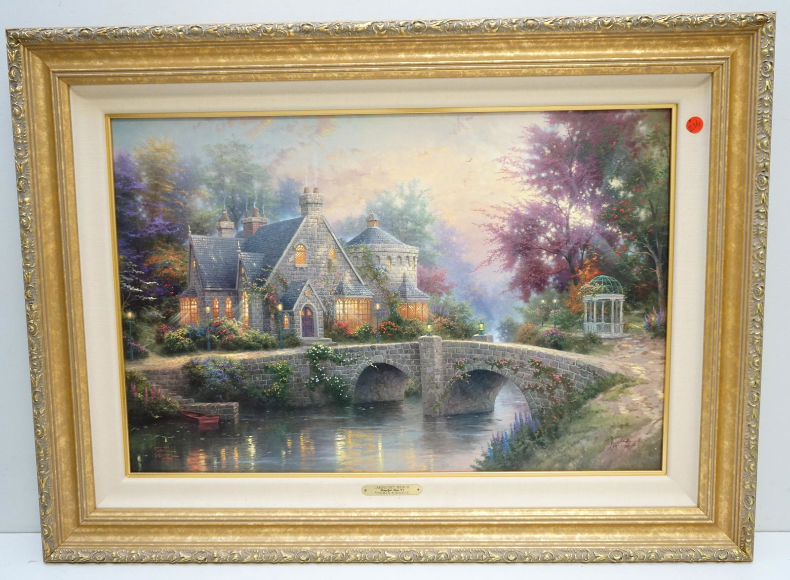 THOMAS KINKADE LAMPLIGHT STUDIO PROOF: Thomas Kinkade Limited Edition Gallery Proof on Canvas "Lamplight Manor". With COA. 657 of 1750. Gallery Frame with Brass Plaque. Measures 35"x26"x2". Weight 10 pds. PROVENANCE: A Private Charleston S