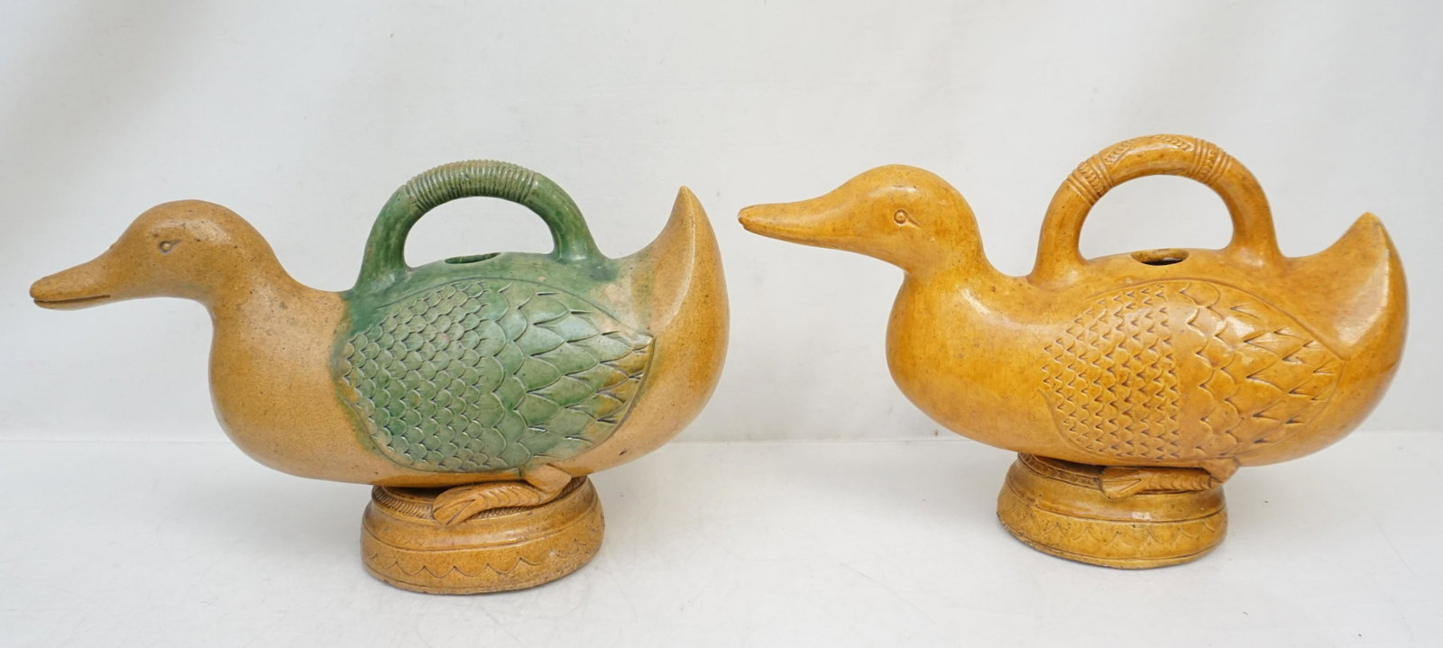 2 CHINESE SANCAI GOOSE TEAPOTS: Two Vintage 20th c. Chinese Goose / Duck Figural Teapots, bothe with Sancai Glaze. Each 12"x4 1/2"x7". Weight combined 4 pds 4 oz. PROVENANCE: A Charleston SC Private Estate.