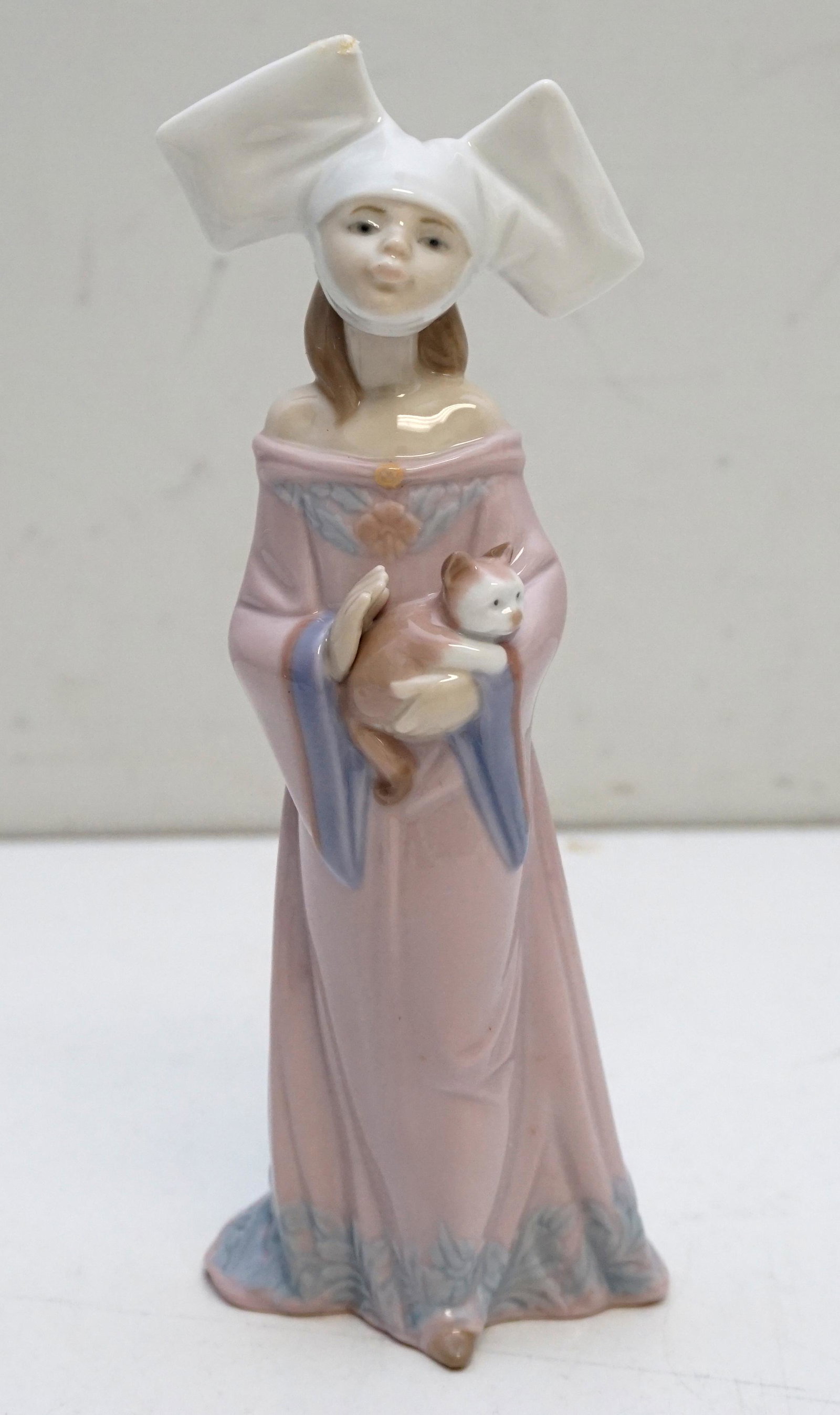 LLADRO # 6110 MEDIEVAL MAIDEN HOLDING CAT: Lladro #6110 Medieval Maiden Holding Cat. In the original Box. Figure 8 1/2" Tall. Box 6"x6"x11 1/2". Weight 1 pd 5 oz.. PROVENANCE: A Private Charleston SC Estate