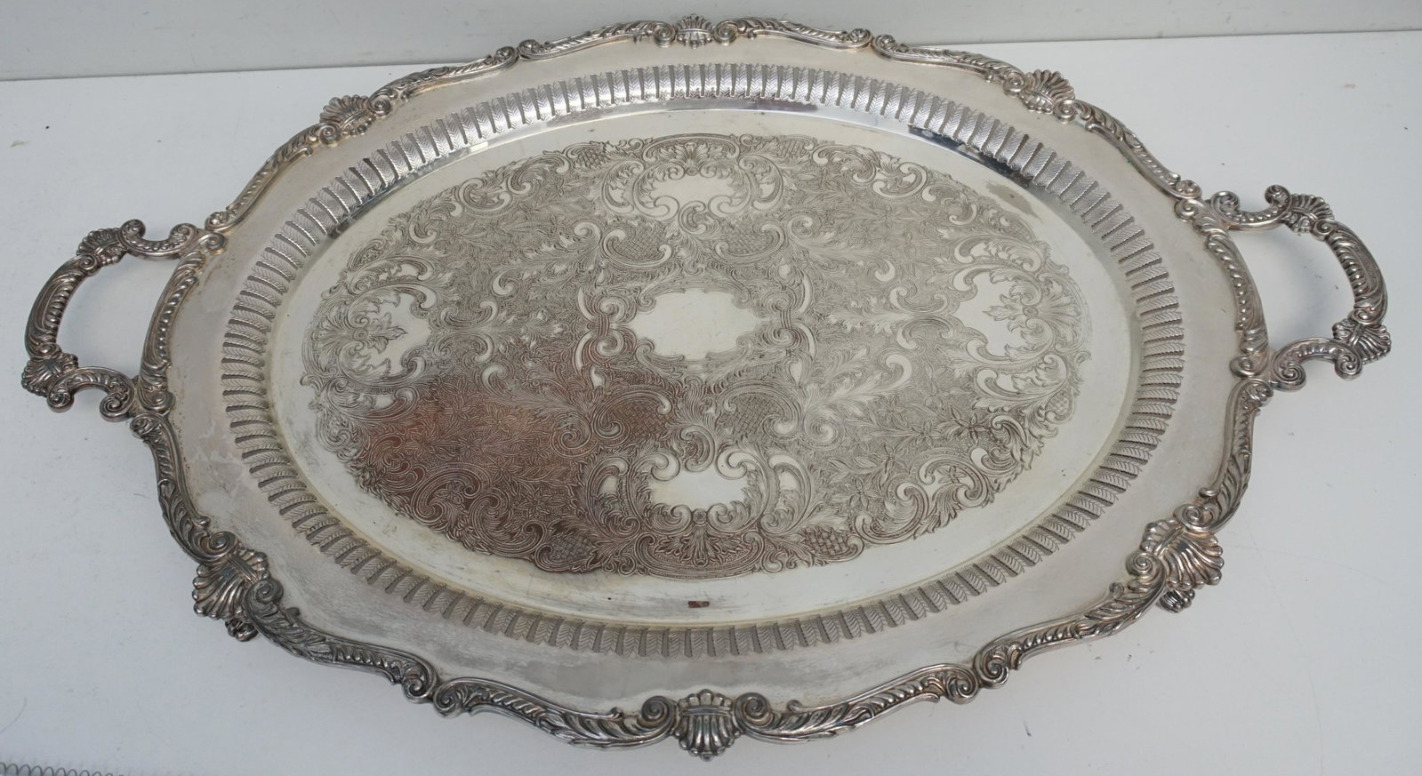 LARGE VICTORIAN SILVER ON COPPER BUTLERS TRAY: Large Victorian Silver on Copper Footed Butlers Tray, Measures 31"x19"x2 1/2". Weight 15 pds. PROVENANCE: Edwin Moore Brogdon, PhD, collection. Dr. Brogdon was the owner of Brogdon Manor, a stately pl
