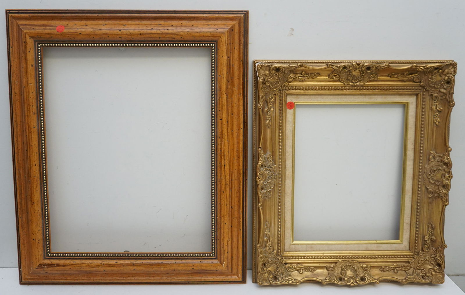 PAIR VINTAGE WOOD FRAMES: Pair of Antique Wood and Gesso Frames. Smaller gilt 19"x 20"x2"- Opening 14"x 11". Large 22 1/2"x26 1/2"x1 1/2". Opening 20"x16". Weight on all 12 pds. PROVENANCE: A Charleston SC Private Estate