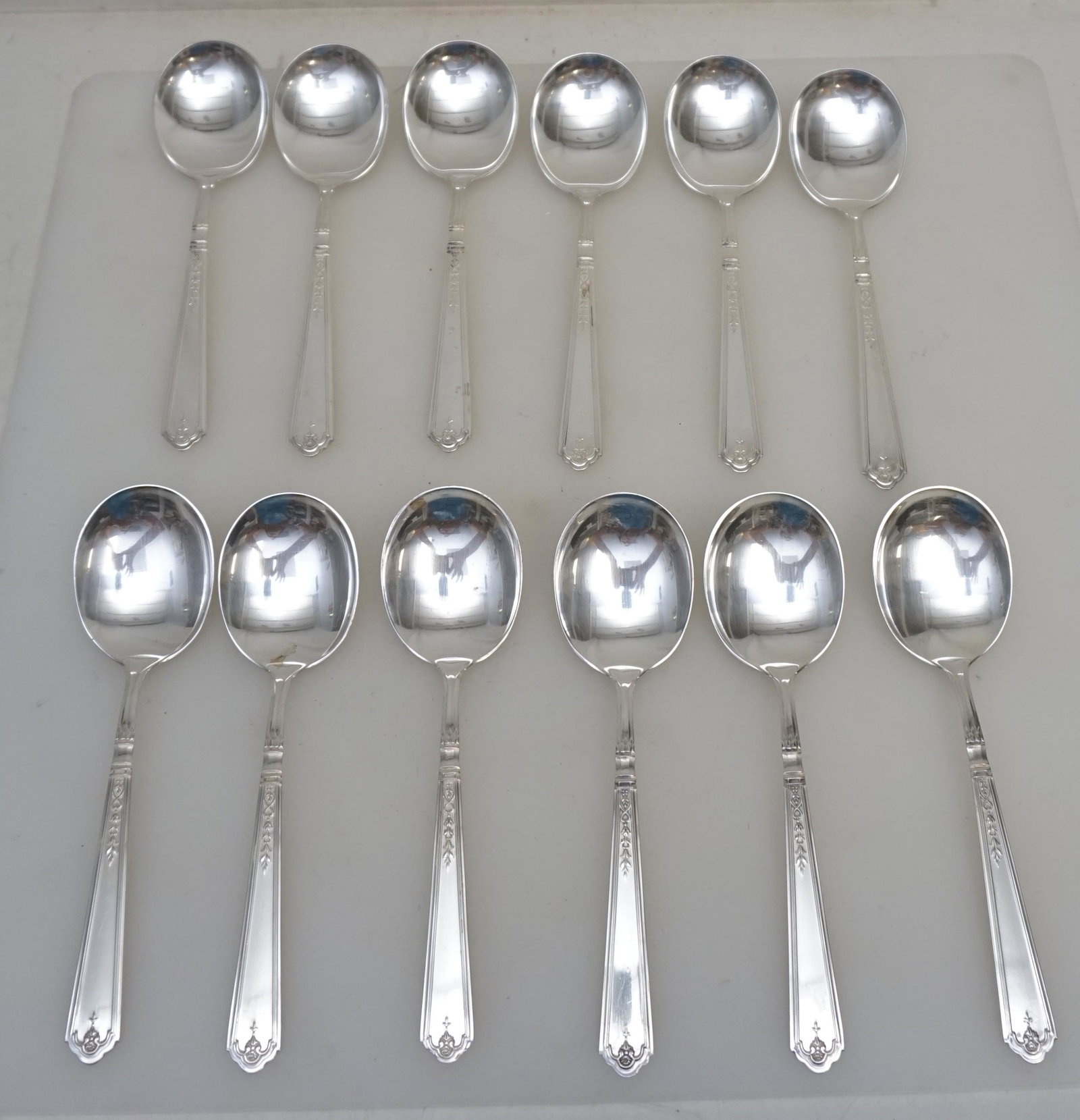 12 GORHAM STERLING PRINCESS PATRICIA CREAM SOUP SPOONS: 12 Gorham Sterling Silver Cream Soup Spoons in the 1926 Princess Patricia pattern. No monograms. Each 6 1/4". Weight on all approximately 420 grams. PROVENANCE: Edwin Moore Brogdon, PhD, collection. D