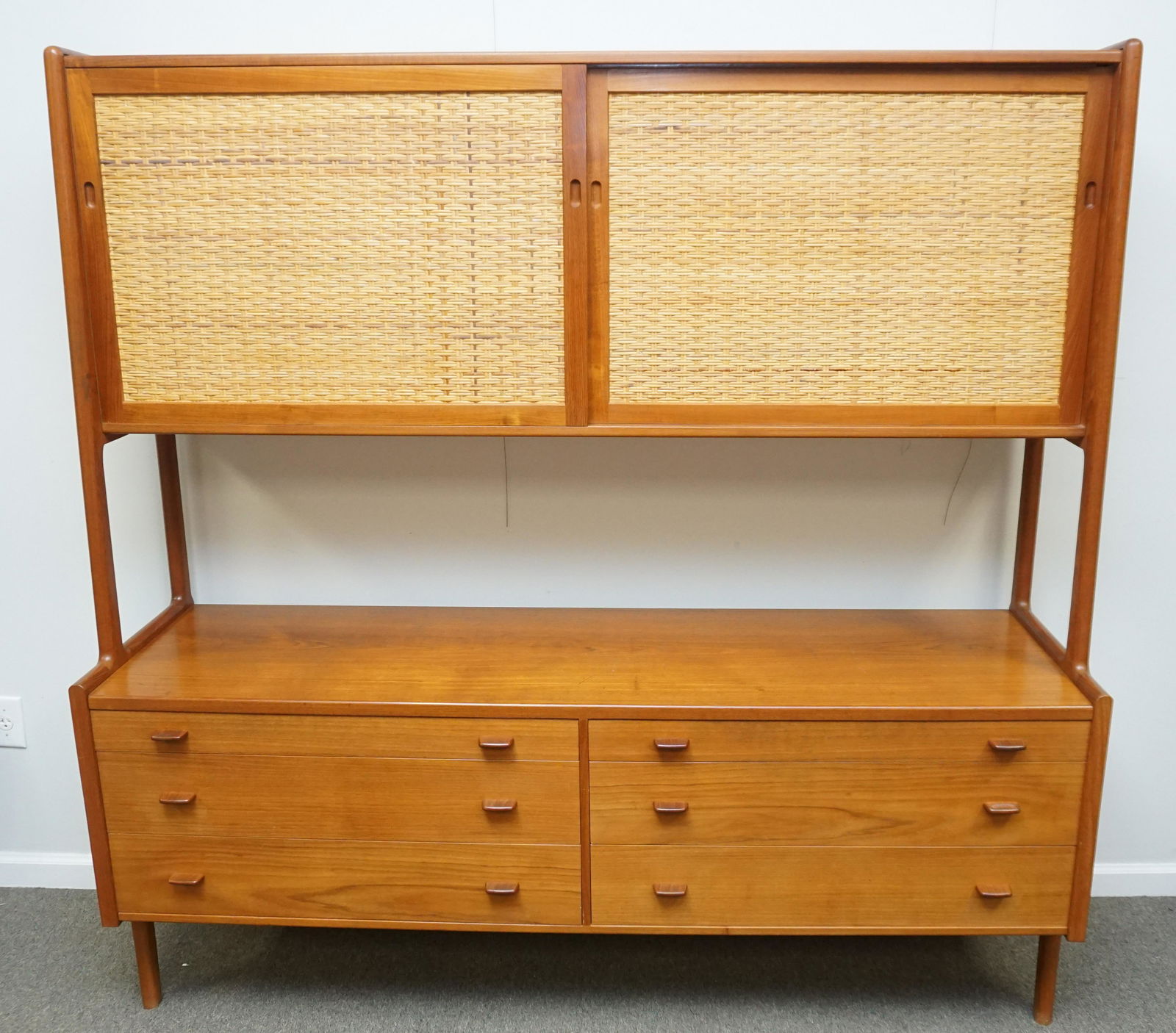 HANS WEGNER DANISH MID CENTURY CABINET: Hans j. Wegner Mid century modern Danish Console / Cabinet c. 1958. Model RY20. Teak and cane. Sliding door upper section over 6 drawer base. Danish control button to drawer interior. Measures71"x20"x