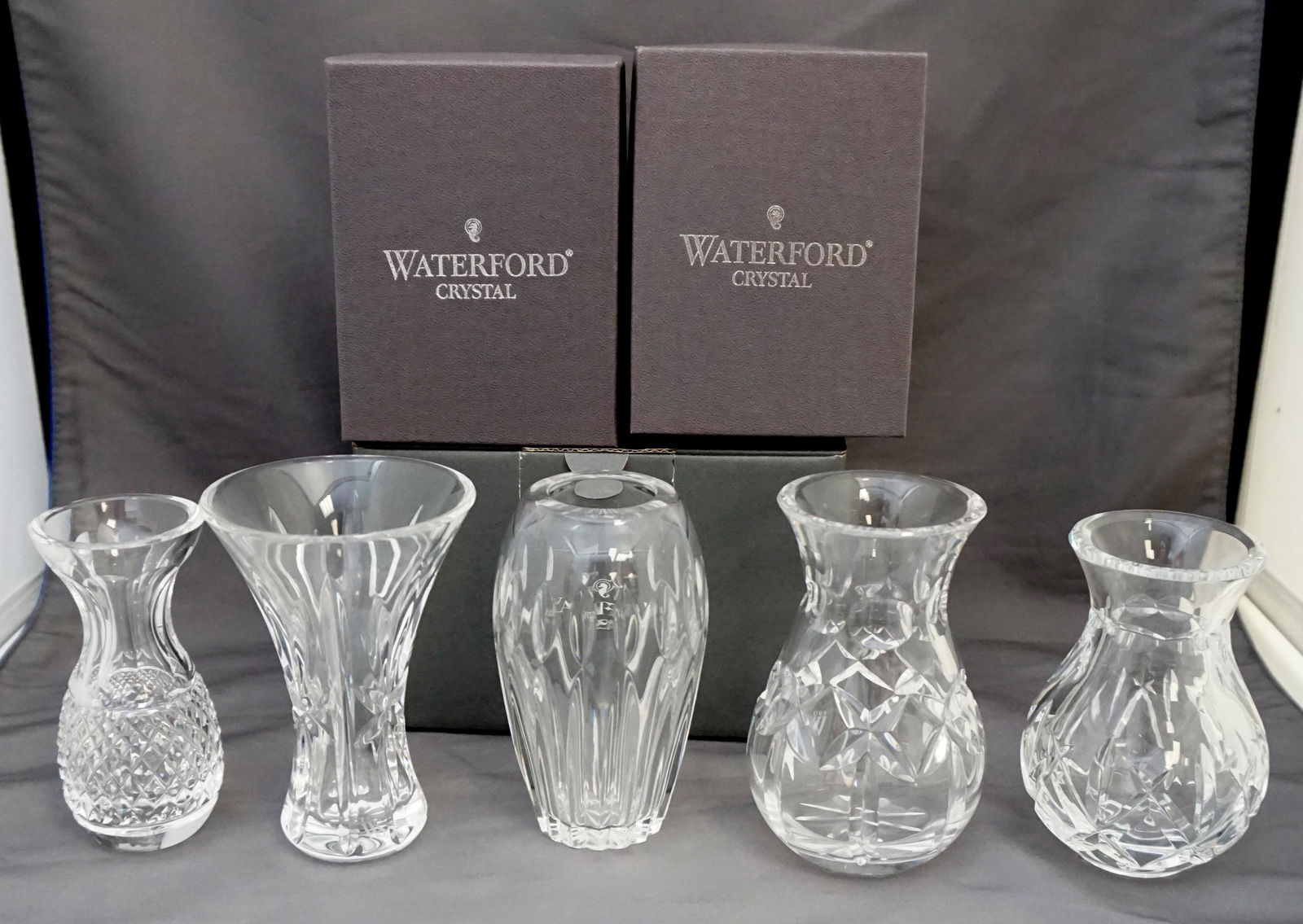 5 WATERFORD CRYSTAL VASES: Waterford Crystal Bud Vases, all with acid etched signature. All in excellent condition. 1-Waterford Society Crystal (1998) Posy Vase 4 3/8" in box.. 2- 1997 Waterford Society Crystal Posy Vase 4 3/8"