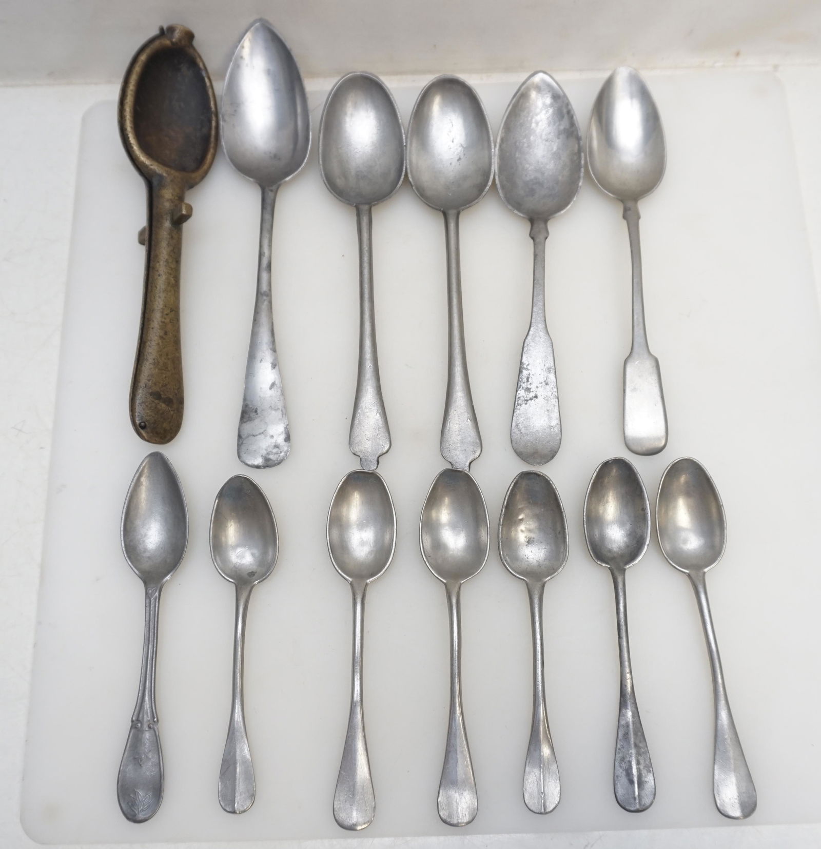 LOT ANTIQUE 19TH C PEWTER SPOONS + MOLD: All are Antique Pewter. All are 18th and 19th c. Included is a Bronze 18th c. Two-part mold for rat tail pewter spoons.1- Set of 6 Matching Spoons 5 3/4", no marks. . 2- Spoon 7 3/8". no marks.3- Pair