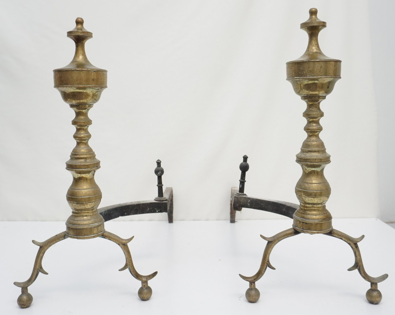 ANTIQUE 19TH C BRASS ANDIRONS: Antique Brass Andirons spur arches, ball feet, original iron posts, English or American, late 19th century, 19" tall. Rust to billet bars. ***Pickup only or Shipping on this item offered through Outwa
