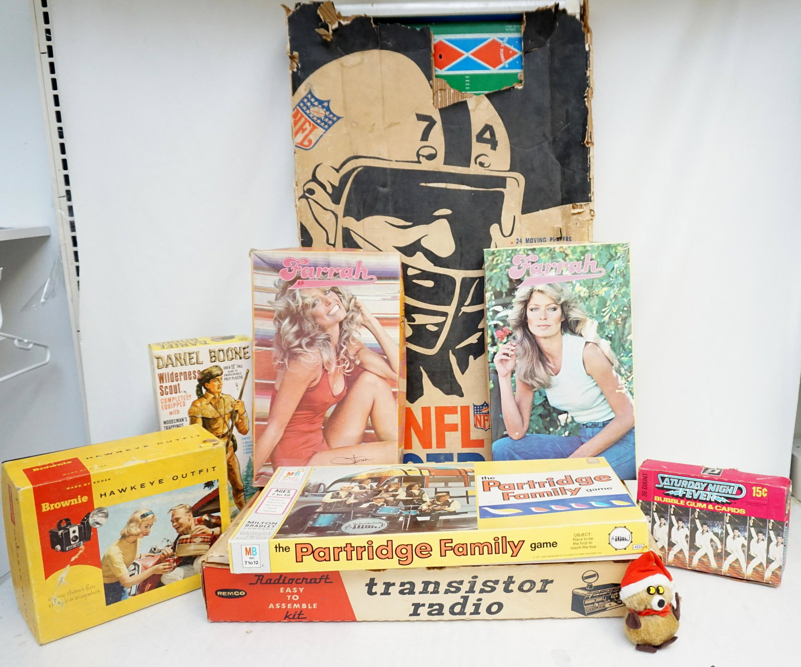 BOX LOT VINTAGE TOYS - CAMERA - GAMES - PUZZLES: All are vintage. 1- Daniel Boone Wilderness Scout Marx Toys in Box. 2- Brownie Hawkeye Oufit in Box. 3- 1977 Saturday Night Fever Bubblegum & Trading Cards in box. 4- The Partridge Family Game. 5- Vin