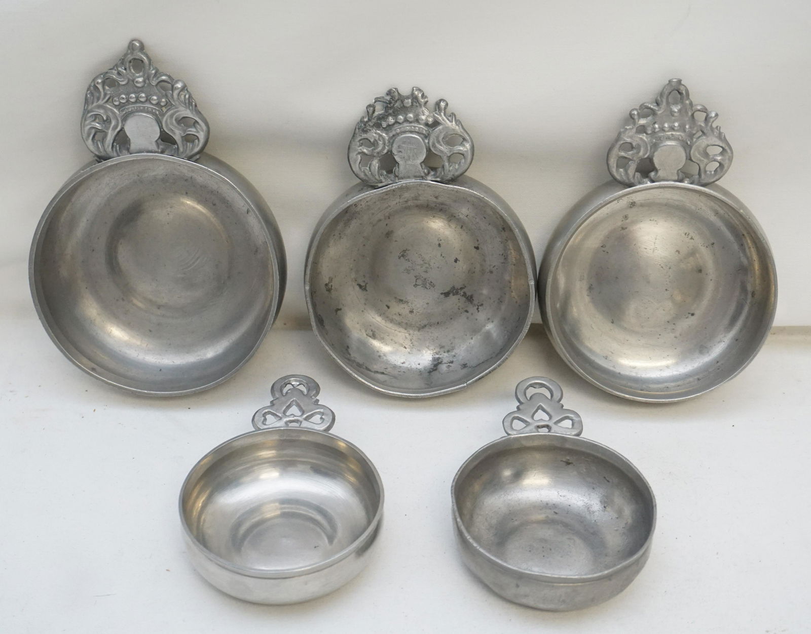 5 18th / 19th c. AMERICAN PEWTER PORRINGERS: All are Antique. 1- Crown Type â€œRG” Porringer, cast-marked porringer that has been attributed to Boston manufacture around 1800. Good condition.The bowl is 4 1/4”.2- Crown Type â€