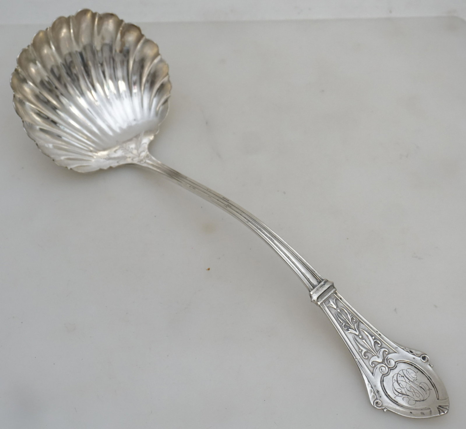 LARGE PHILADELPHIA COIN SILVER LADLE: 19th c. Philadelphia Coin Silver Aesthetic Movement Punch Ladle c. 1870-80. Made by William Faber & Son, Philadelphia. Measures 13" long. Weight approx 155 grams PROVENANCE: Edwin Moore Brogdon, PhD, 