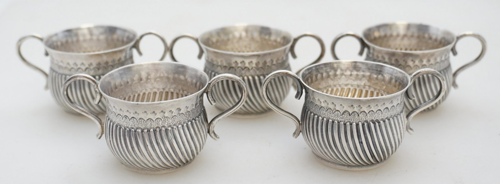 5 19th c ENGLISH STERLING SALT CELLARS: Five (5) English Sterling Silver Individual Salt Cellars. Fine detailing, made by Daniel and John Welby, London in the year 1889. Each 2 1/2"x1 1/2"x1 1/4". Approximate weight on all 140 grams. PROVEN