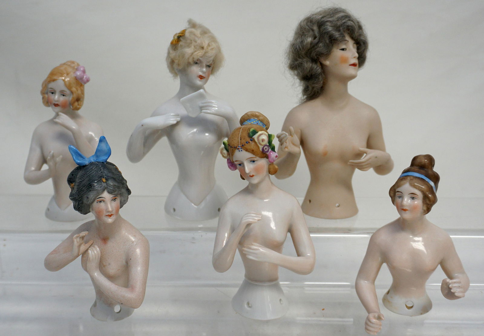 6 GERMAN NUDE HALF DOLLS - ARMS AWAY: 6 Antique / Vintage German Porcelain "Arms Away". Half Dolls. 2 with real hair wings. One with flowers in hair with old Goebel mark. The tallest at 5" with Silver/Gray Wig has one arm glued. The rest