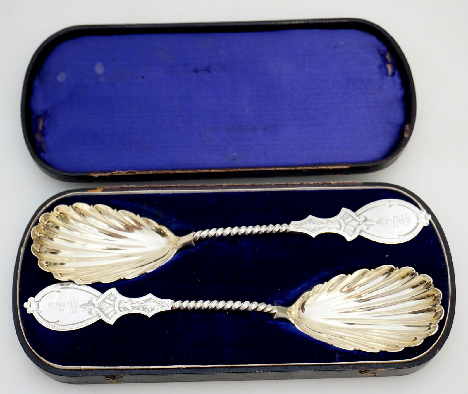 2 JOHN POLHAMUS COIN SILVER CASED SERVING SPOONS: Two 19th c. Coin Silver Large 9" Serving Spoons made by John Polhamus of New York c. 1865 and originally retailed at Ettenheimer & Co. in Rochester. The serving spoons with turned stem and scalloped g
