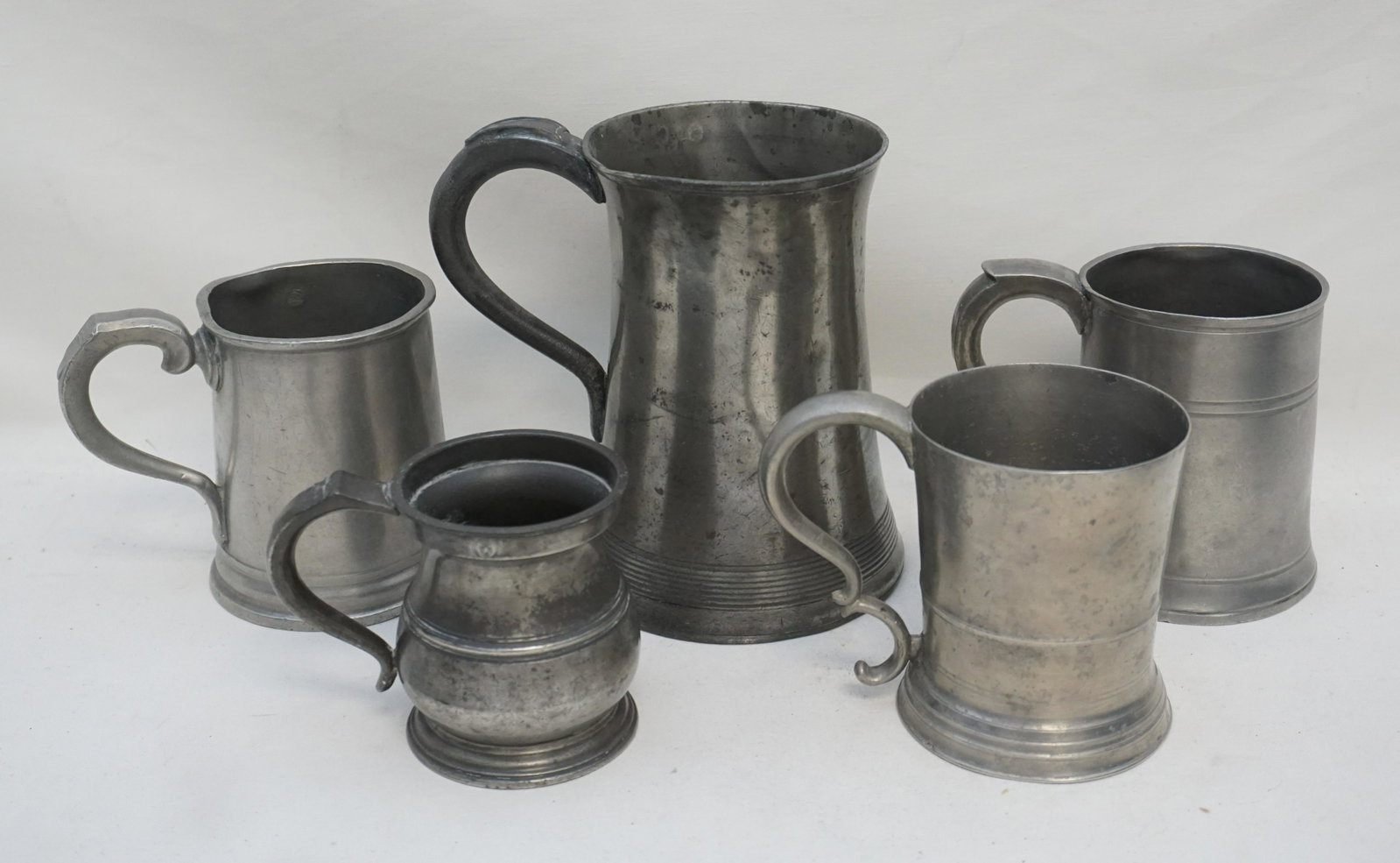 5 ANTIQUE 18th/19th C PEWTER MUGs: All are Antique. 1- Pint Mug, Late 18th, Early 19th c. 4 1/2", Mark for Samuel Danforth, Hartford CT.good antique condition. 2- Pint Mug, Late 18th, Early 19th c. 4 1/2'. mark illigible. sides misshap
