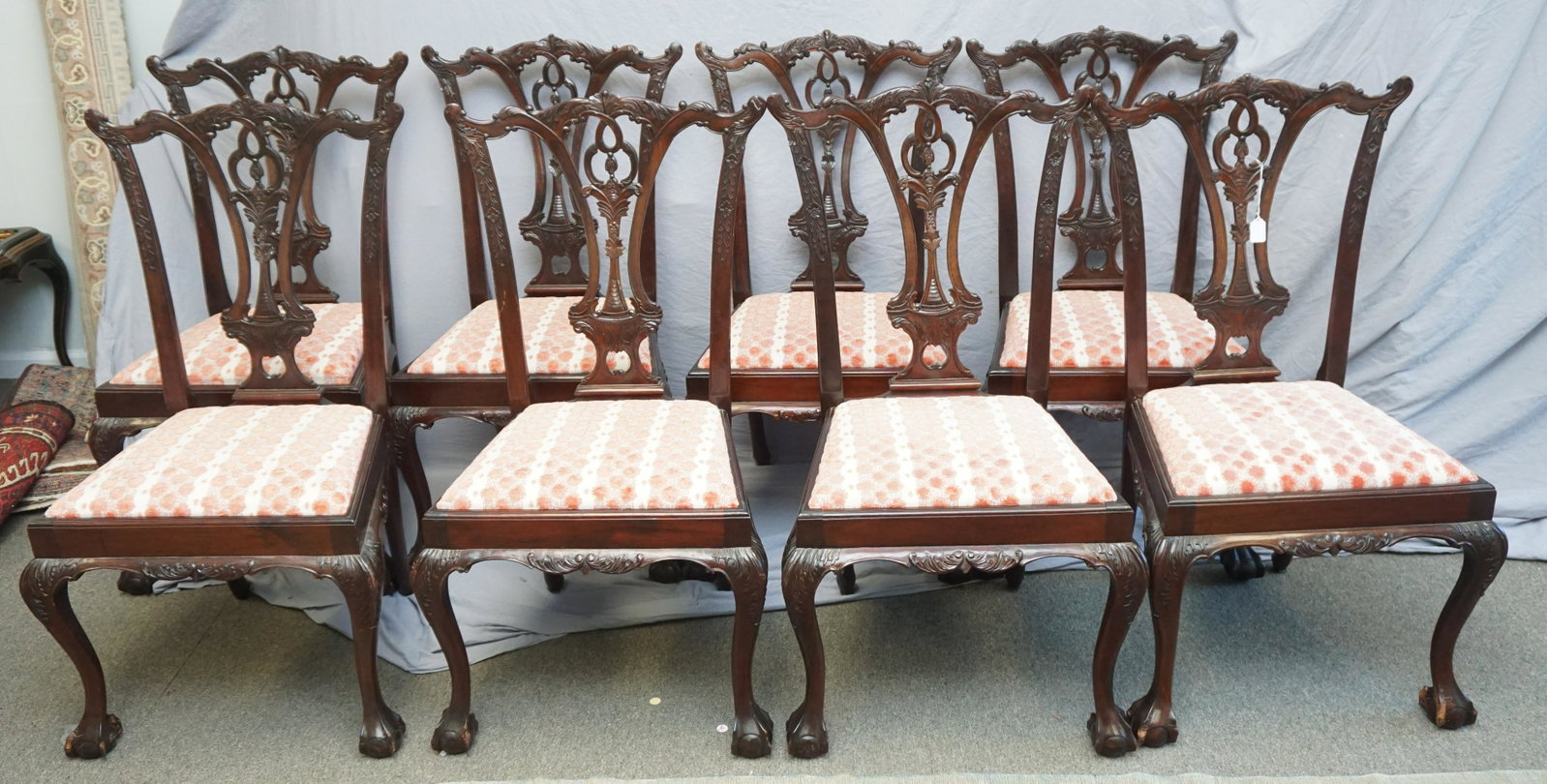 8 CHIPPENDALE MAHOGANY BALL & CLAW CHAIRS: Set of 8 Late 19th, Early 20th c. Chippendale Style Carved Mahogany Ball & Claw Chairs. Removable seat cushions. Overall good condition with minor wear, small split to 1 back, scuffs to feet, 1 chair 