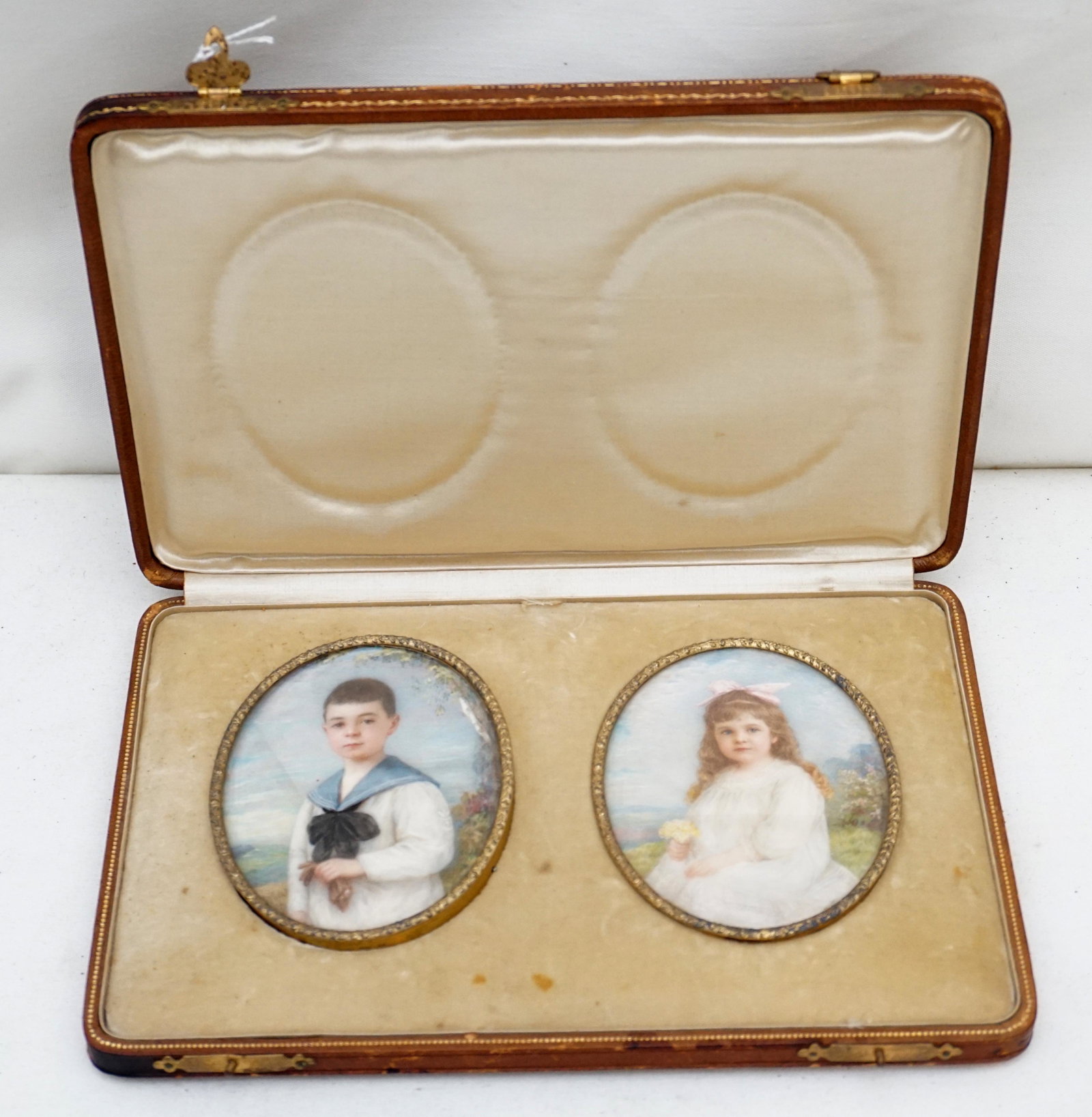 PAIR MINIATURE PORTRAITS OTTO E ECKHARDT: Pair of exceptional Miniature portraits c. 1910 by Otto E Eckardt of Dresden, Germany. Both in German gilded 800 silver easel back frames. In original travel box. PROVENANCE: A member of the Carroll f