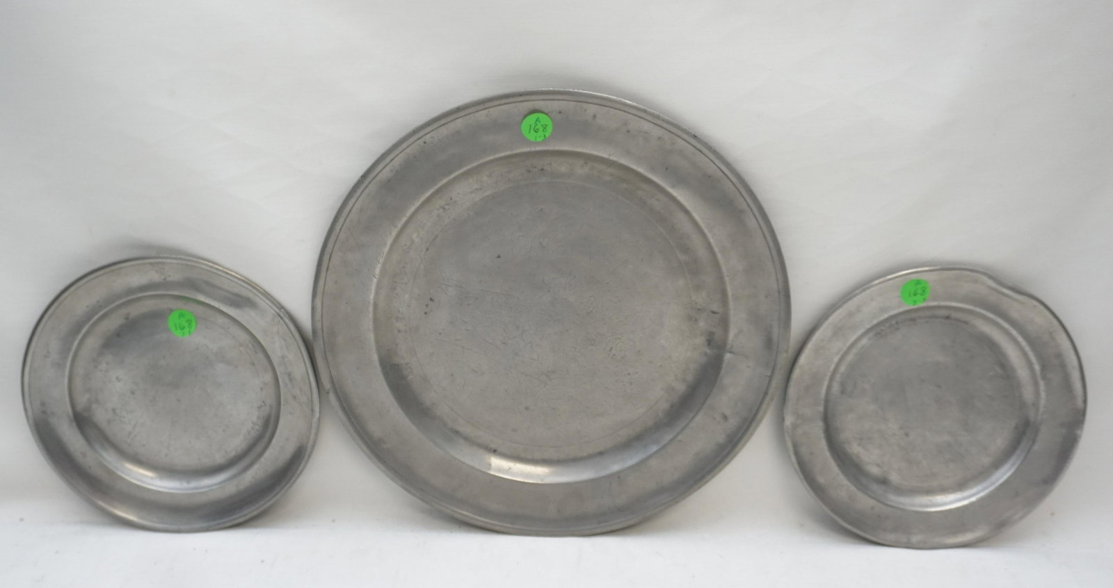 3 ANTIQUE 18th/19th AMERICAN PEWTER CHARGER + PLATES: All are Antique. 1- Charger 12 1/4 by Jacob Whitmore who worked in Middletown, CT from 1758-1790, good, minor wear. 2- Plate 7 3/4" by Ashbil Griswold, Meriden, CT. He worked from 1802-1842. rim bent,