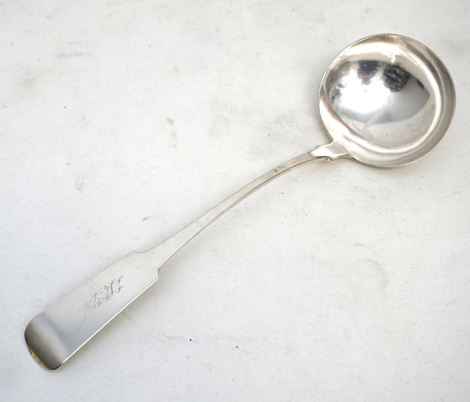 LARGE AMERICAN COIN SILVER LADLE c 1840: Large American Coin Silver Ladle in the Fiddle Pattern by Thomas Stephenson, Buffalo, NY c. 1840. Monogrammed. Measures 13". Weight 195 grams. PROVENANCE: Edwin Moore Brogdon, PhD, collection. Dr. Bro