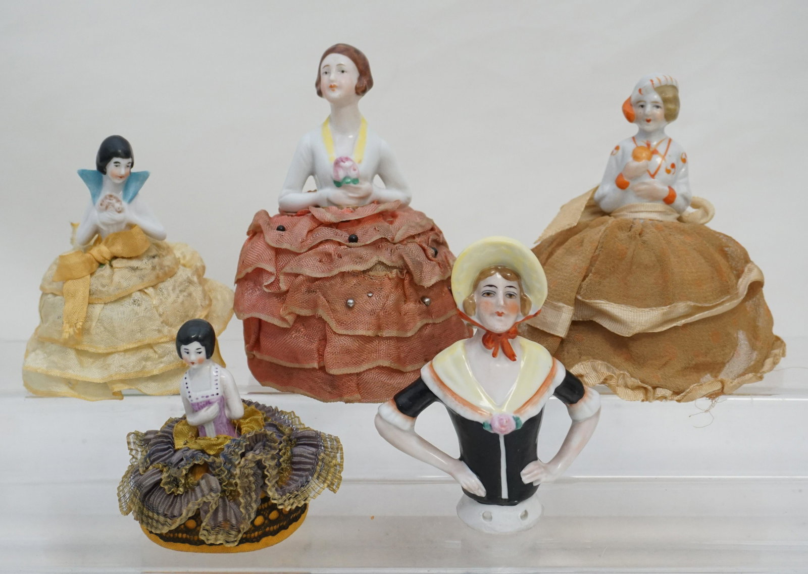 5 GERMAN PORCELAIN HALF DOLL PINCUSHIONS: Five (5) Art Deco Era Elegant 1920s-30s German Porcelain Pincushion Half Dolls. Beautifully dressed. All in good condition, minor wear to clothing, see all photographs. .All measure 3" to 5 3/4". Weig