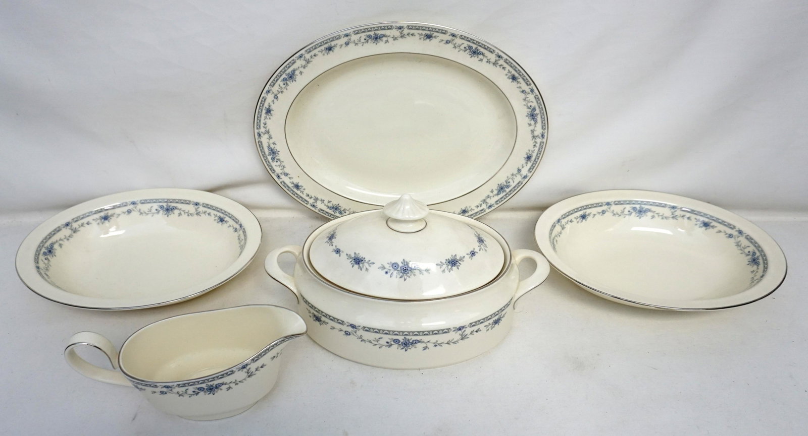 5 PC MINTON BELLEMEADE SERVING ITEMS: All are Minton Bellmeade, blue floral, platinum accents. 1 Bellemeade Gravy Boat 8 ". 2 Bellemeade Oval Vegetable Bowls 10 3/4". 1 Bellmeade Oval Covered Vegetable 11 1/2" . 1 Bellmeade Oval Serving P