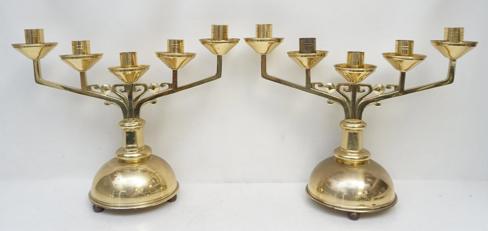 BRASS ART DECO CANDELABRA: Pair of Brass Art Deco Candelabra. Each hold 6 candles. They each measure 16"x6"x13". Weight combined 11 pds 6 oz. PROVENANCE: Edwin Moore Brogdon, PhD, collection. Dr. Brogdon was the owner of Brogdo