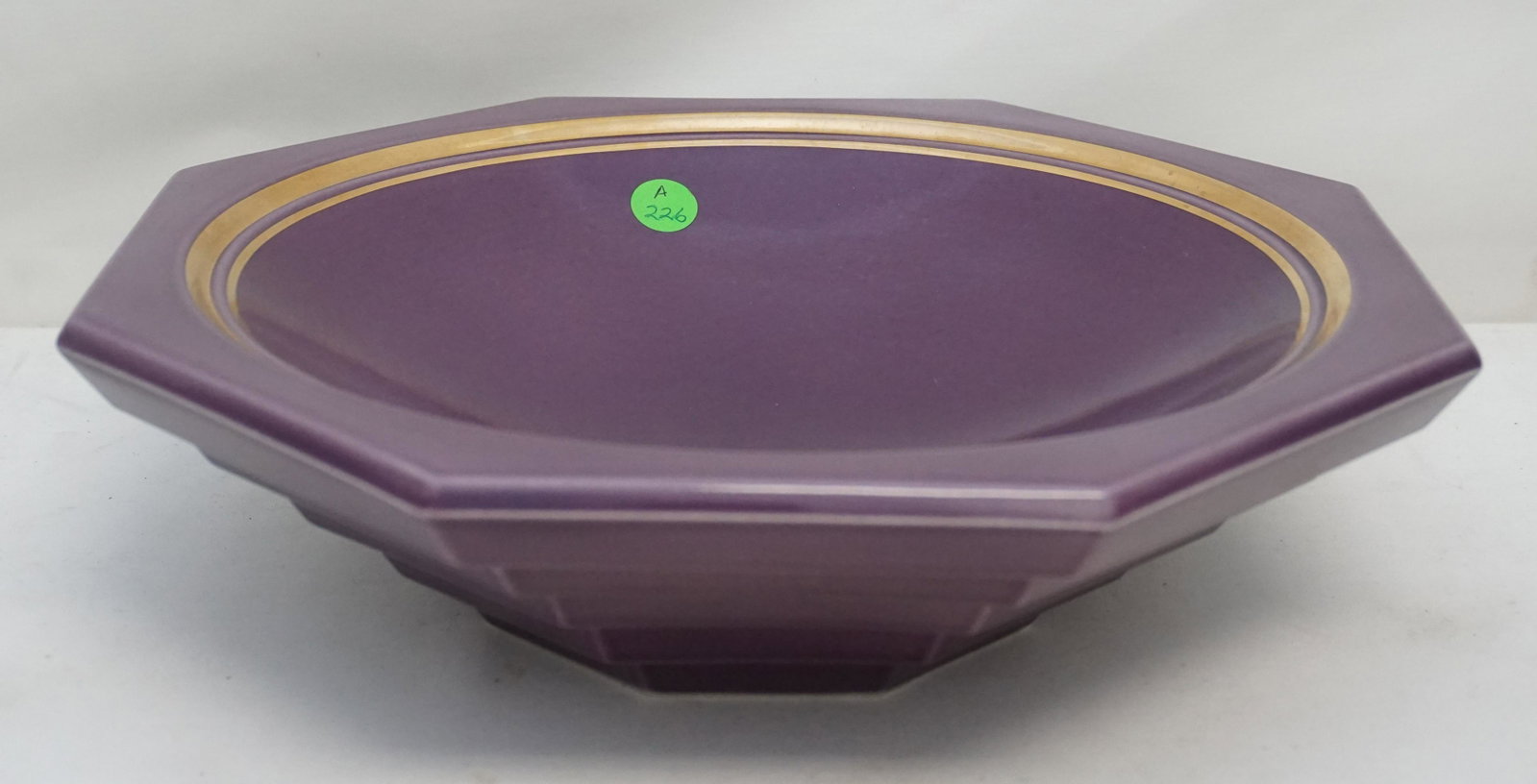 LARGE ART DECO PORCELAIN BOWL: Large Purple Art Deco Style Porcelain Bowl, Signed "Larson:, Measures 12 1/2"x12 1/2"x3 1/2". Weight 5 pds 6 oz. PROVENANCE: A Private Charleston SC Estate.