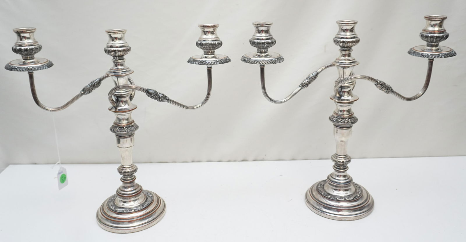 PAIR SILVERPLATE CANDELABRA: Pair of Vintage 3 Light Silverplate on Copper Candelabra. Each 15 1/2"x5"x14 1/2". Weight 8 pds 10 oz. PROVENANCE: Edwin Moore Brogdon, PhD, collection. Dr. Brogdon was the owner of Brogdon Manor, a s