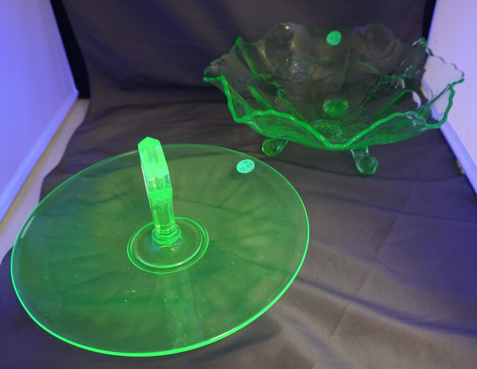 2 VASELINE GLASS BOWL + TIDBIT: Both are Vintage. 1- Fenton Green Vaseline Glass Stag and Holly Footed 10" Bowl. 2- Vaseline Tidbit 1930s 10 1/2". Weight on both combined 2 pds 13 oz. PROVENANCE: Edwin Moore Brogdon, PhD, collection