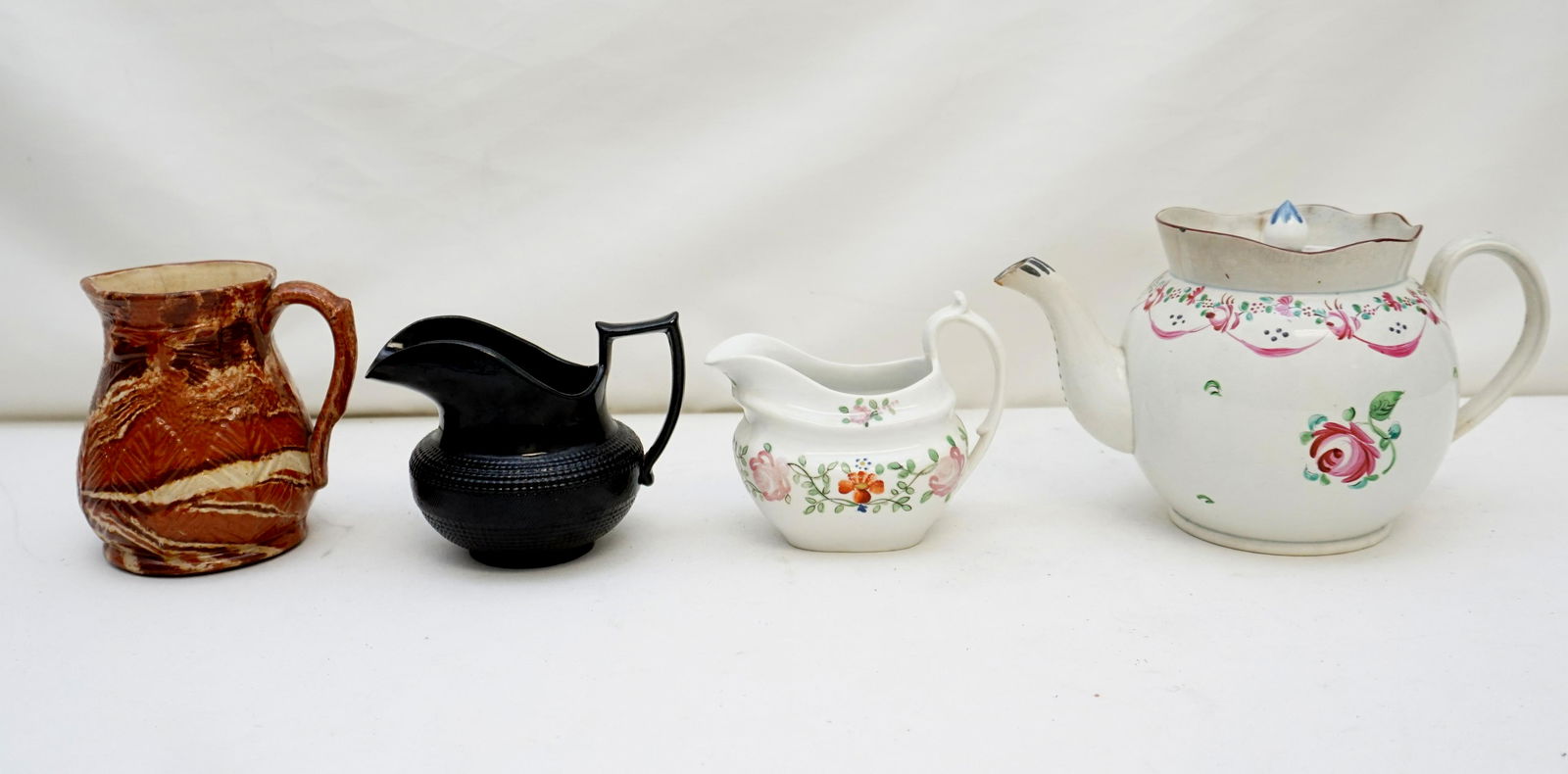 4 pc 18th /19th c ENGLISH PORCELAIN: All are Antique English. 1- Antique English Porcelain Sauce Boat 5"x4 1/2". Good condition. 2- Antique Staffordshire mid 18th c Agateware Creamer / Jug 5". Heavy Cracquelure- / lines to interior. 3-An