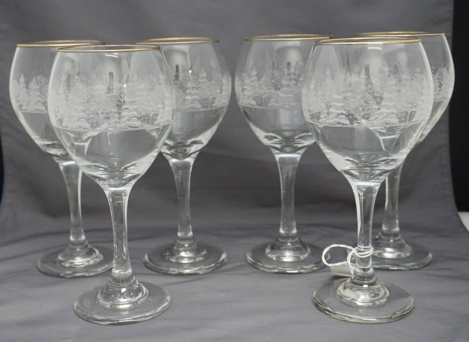 6 LIBBEY WINTER HOLIDAY WINE GLASSES: Set of six (6) Libbey Winter / Holiday Scene Wine Glasses, Gold Rimmed Glass Stemware c. 1980s. Each 7 3/4" . Weight 3 pds 4 oz. PROVENANCE: Edwin Moore Brogdon, PhD, collection. Dr. Brogdon was the o