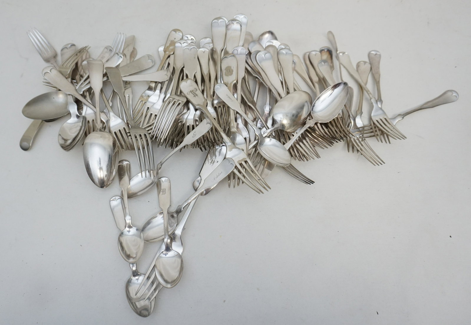 80 pc ANTIQUE FIDDLE TIPT + FLATWARE: 80 Pieces of Various Silverplate Fiddle Tipt and Fiddleback Flatware. All are Antique. 64 Forks and 16 Spoons. Weight on all 8 pds. PROVENANCE: Edwin Moore Brogdon, PhD, collection. Dr. Brogdon was th
