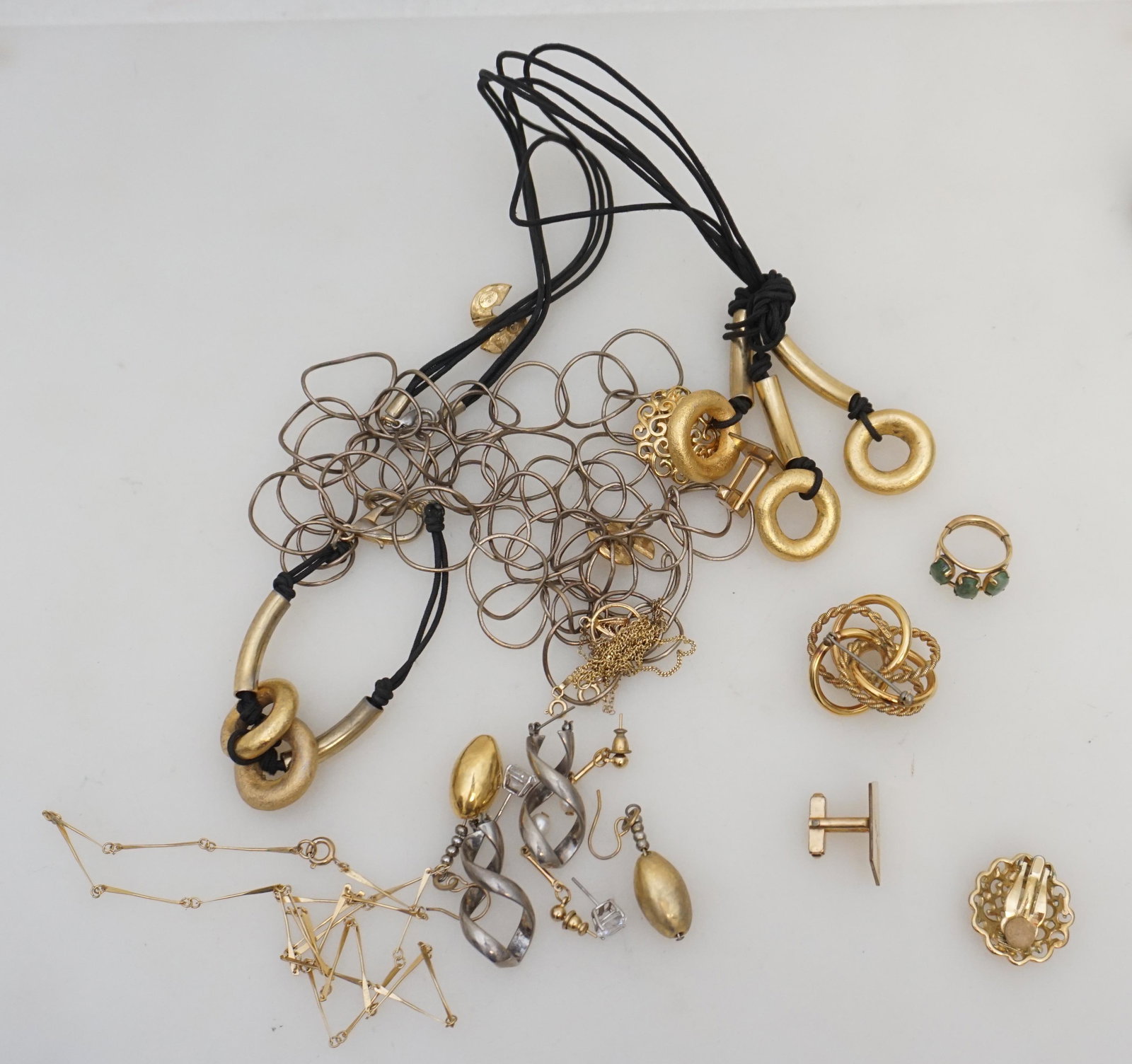 13 pc. Costume jewelry + 14K: 13 pc. Costume jewelry Givenchy clip on earrings. Givenchy Pierced Earrings. 4 pair pierced earrings. 4 necklaces (1 pair tangled) 1 Very fine necklace marked 525 for 14k. . Brooch Twist Gold Filled 1