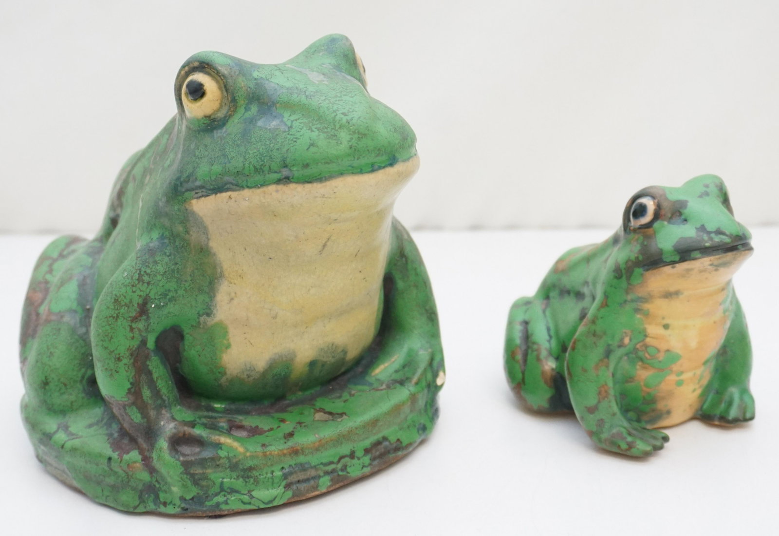PAIR WELLER POTTERY COPPERTONE FROGS LARGE: Pair of original Weller Pottery, Zanesville Ohio Coppertone Frogs. Large Frog 6". Smaller 4". Weight combined 4 pds. Designed by Weller ceramic artist Rudolph Lorber in 1929, the Coppertone line of po