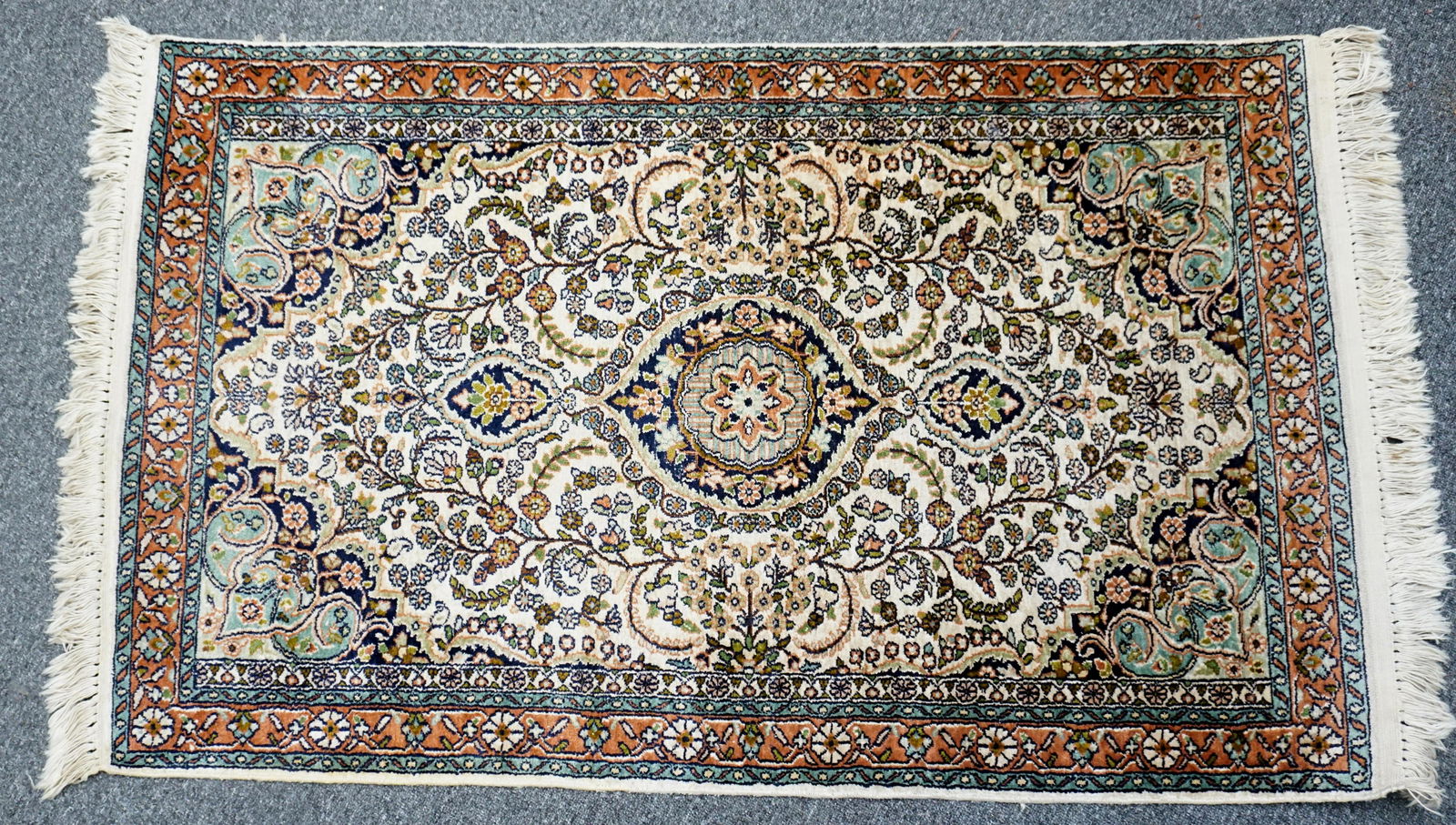 SEMI ANTIQUE HAND WOVEN NAIN SILK RUG: Fine Semi Antique Hand Woven Persian Silk & Wool Nain Rug. Iran. Ivory with blue, greens and reds. Measures 2'6"x4'2". Weight 6 pds. PROVENANCE: A Washington DC/Charleston SC Private Estate