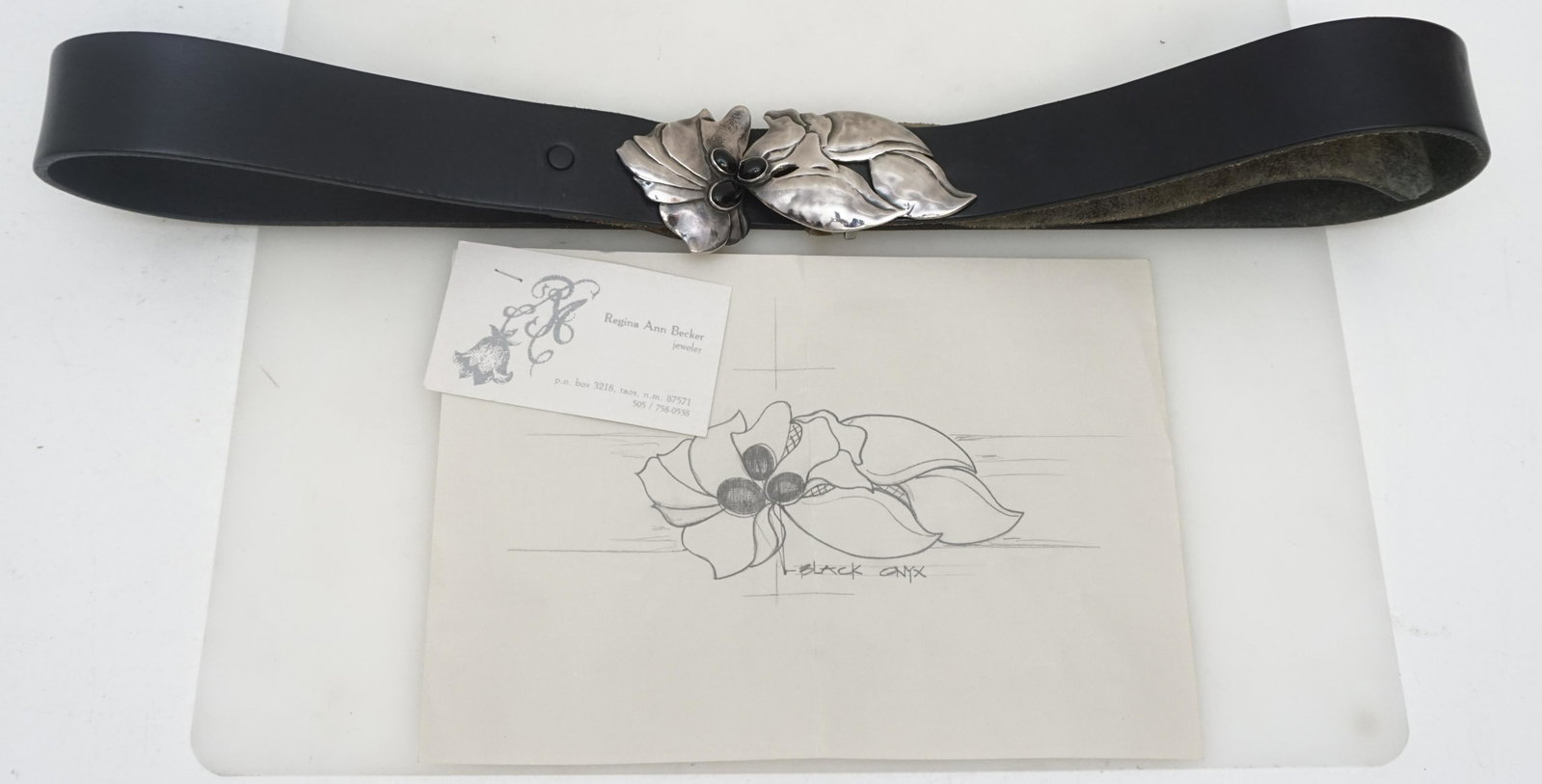 CUSTOM STERLING & ONYX BUCKLE + BELT: Custom designed and hand made Sterling Silver and Onyx Belt Buckle by Taos Artist Regina Ann Berker at the Morgan Gallery in Taos. On Black English Leather Adjustable Belt. Buckle 4 3/4". Weight on al