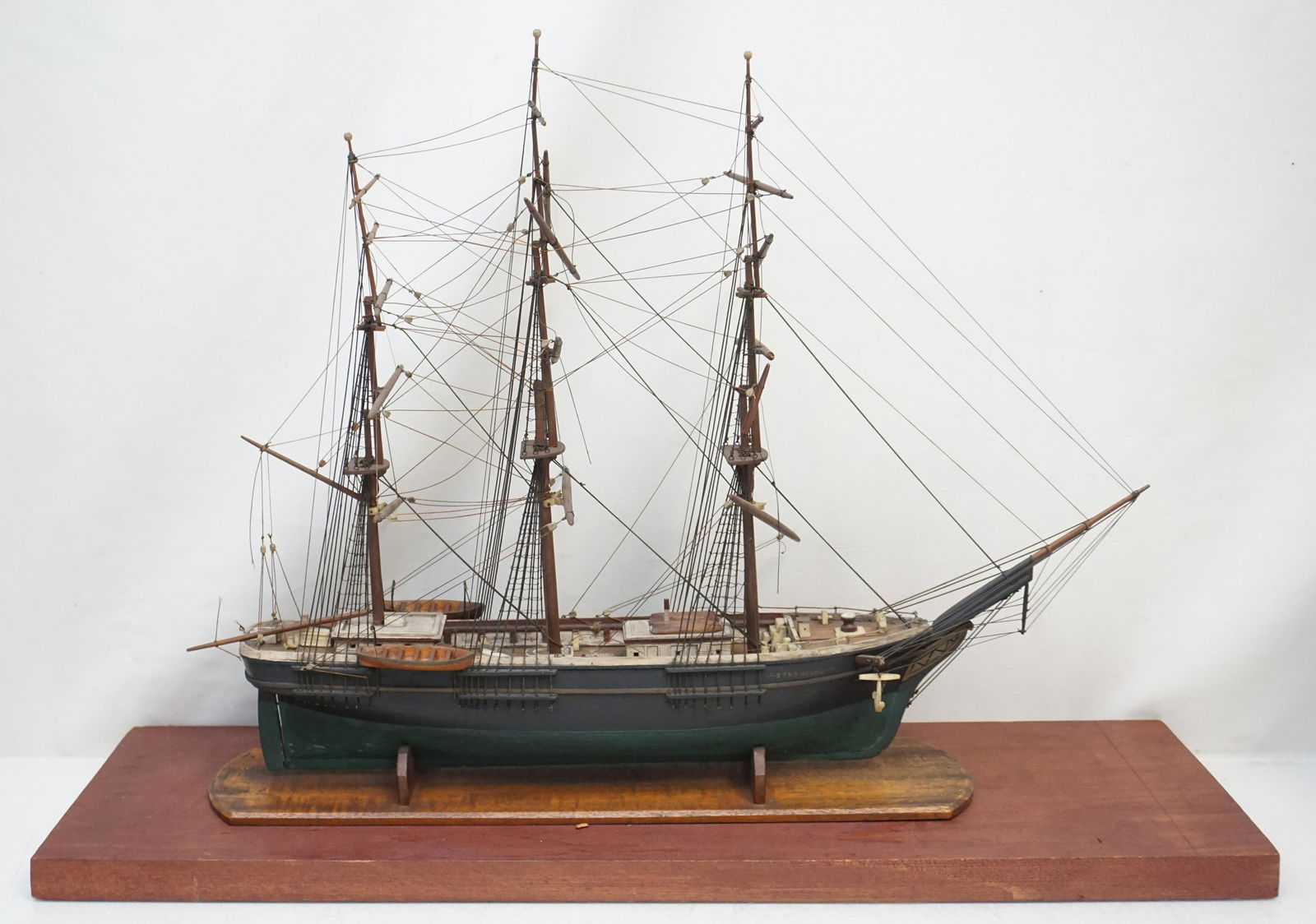 MODEL OF THE EXTREME CLIPPER STAGHOUND: Anonymous; American, 20th century Model of the Extreme Clipper Staghound. The deck of the model is planked in mahogany and is fitted with numerous details which include: anchors, bollards, capstan, pi