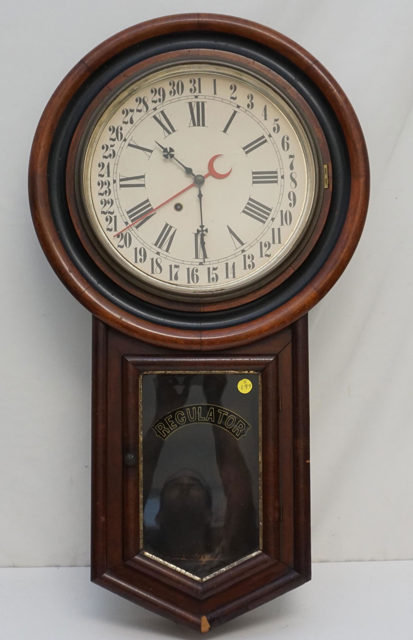 NEW HAVEN REGULATOR WALL CLOCK: New Haven No.1 Time Regulator: 8 day, metal painted dial, veneer case, painted, stenciled glass with original label on the back of the clock, has pendulum with pendulum hanger broken. Has no key. Has