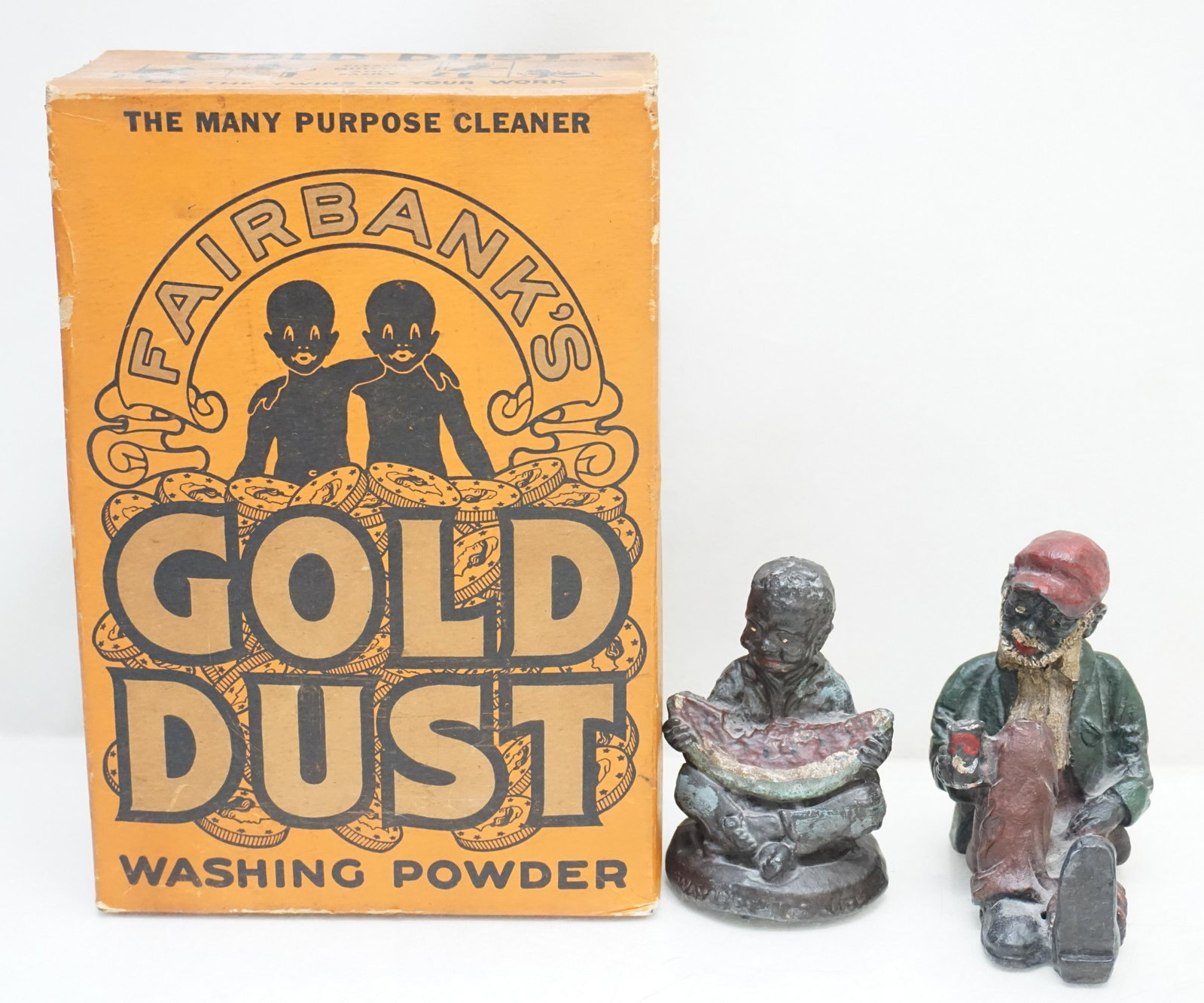 3 pc BLACK MEMORABILIA CAST IRON +: 1- Fairbankâ€™s Gold Dust Washing Powder. By the Lever Brothers Company New York. 2- A cast iron black Americana paperweight of a child, circa 1900, inscribed Way Down South. Depicting a seated b