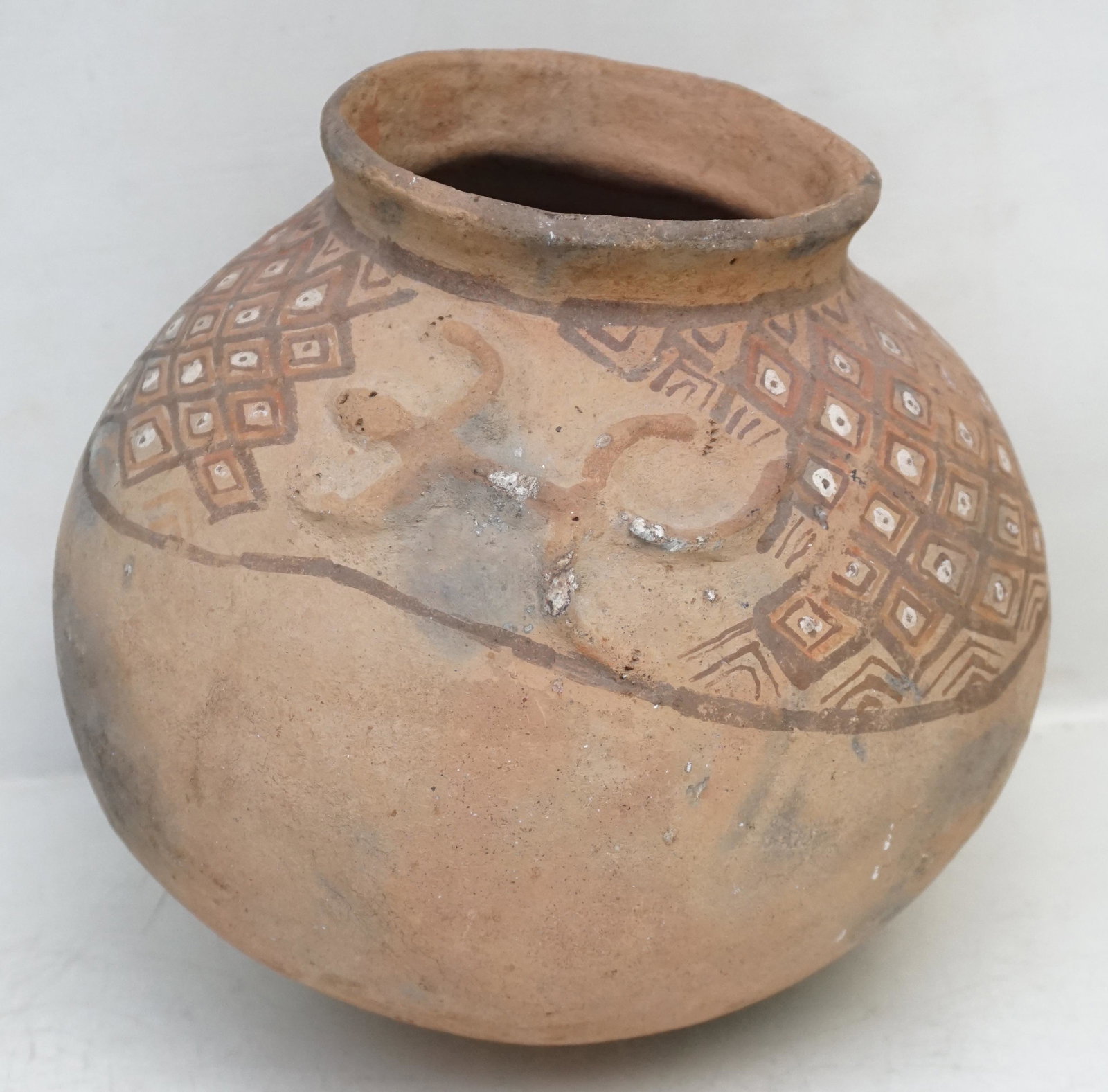 ANTIQUE TIMOR VERMASSE POTTERY: Antique Vermasse terracotta pigmented pottery from the remote East Timor Island of Indonesia. The pottery is adorned with lizard motifs in relief combined with geometrical designs similar to that of N