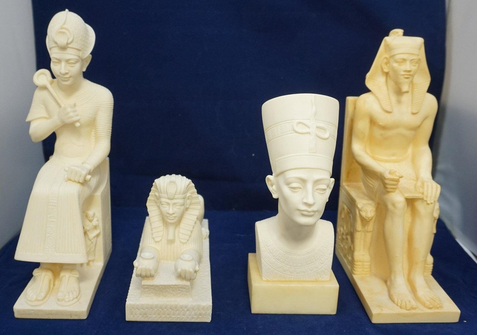 4PC COMPOSITE ITALY EGYPTIAN STATUES: 4 Composite Resin Egyption Figures, all Made in Italy. Two are 10" tall, 1 is 8" tall and Sphinx is 4 1/2" tall. Weight on all 11 pds. PROVENANCE: A Charleston SC Private Estate.