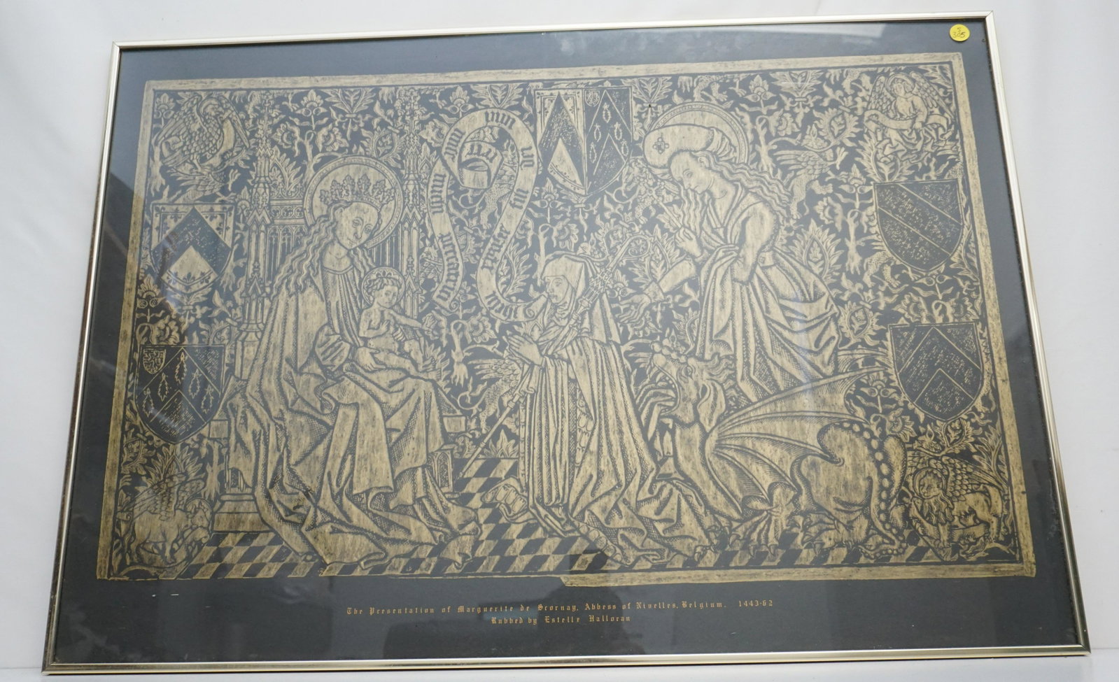 BRASS RUBBING MARGUERITE DE SCORNAY: Vintage Framed Brass Rubbing famous memorial plate to Marguerite de Scornay, who was Abbess of Nivelle in Belgium from 1443 - 1460. Rubbed by Estelle Halloran In frame measures 14 1/2"x35"x1". Weight 