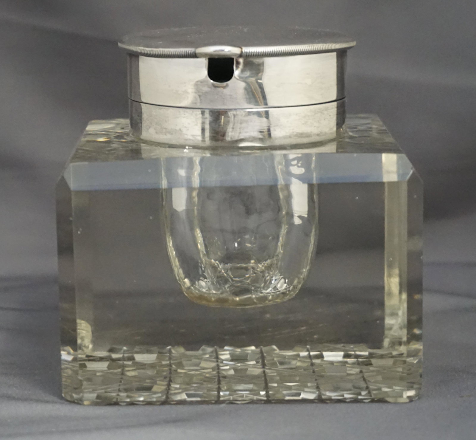 ENGLISH EDWARDIAN STERLING & CUT CRYSTAL INKWELL: English Cut Crystal and Sterling Silver Edwardian Inkwell 1903 By John Grinsell & Sons, London. Measures 3 1/2"x3 1/2"x3 1/2". Weight 2 pds 9 oz. Nicks to 3 bottom corners. PROVENANCE: A Private Charl