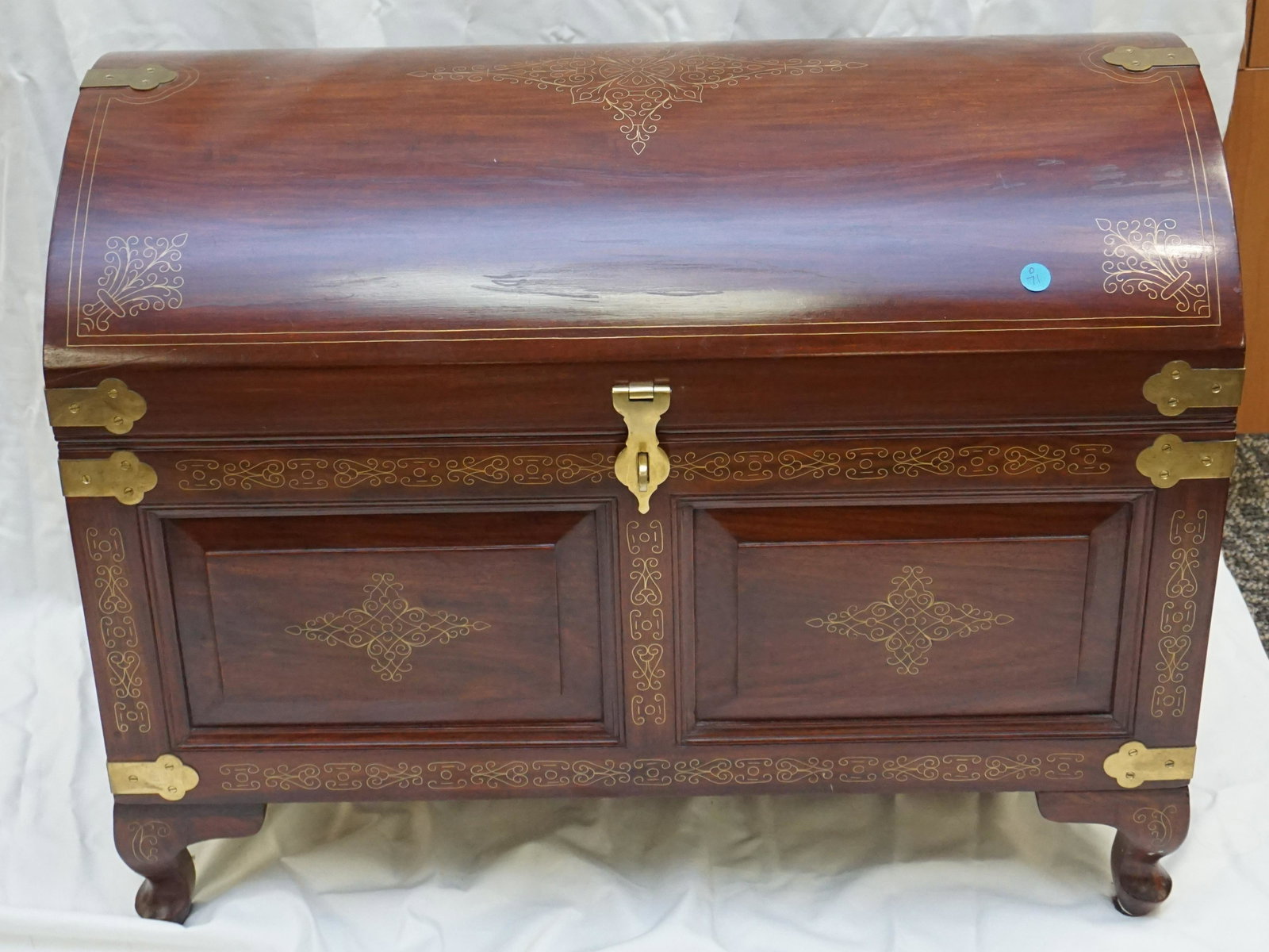 ROSEWOOD & BRASS INLAID CHEST: 20th c. Anglo Indian inlaid Brass Sheesham Rosewood Captains Style Chest, made in Pakistan. Having a domed lid with brass straps, inlaid with brass scrolling design, having two panels to front, interi