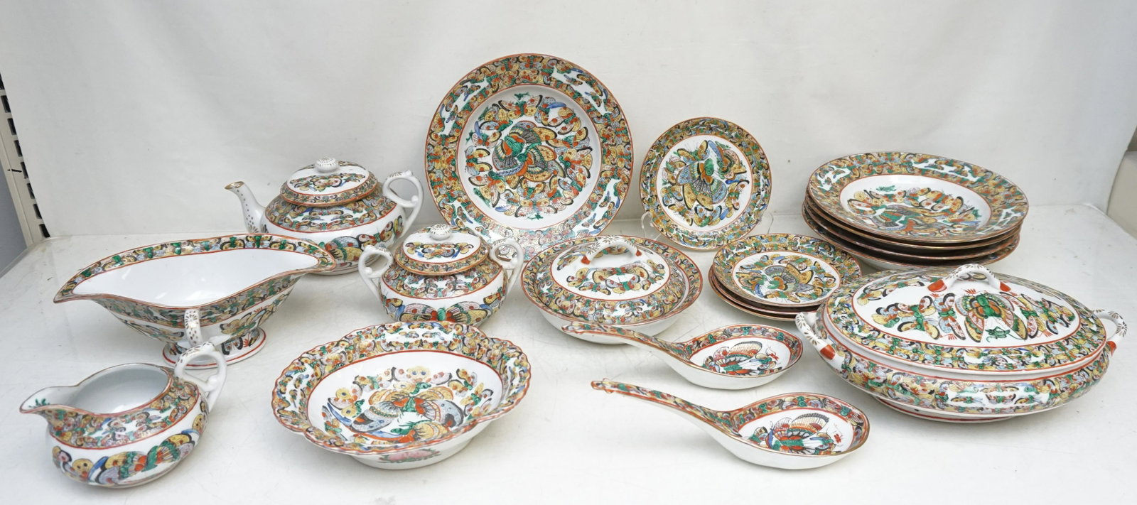 18 PC 1000 BUTTERFLY CHINESE EXPORT: 1000 Butterflies Chinese Export Porcelain, 18 Pieces. To include Teapot 7 3/4" long, Covered Sugar 4" tall, Creamer 3" tall, 4 Small Plates 5 1/2", 5 Bowls 8 1/2". 2 Ladles 8" long, Covered Tureen 10"