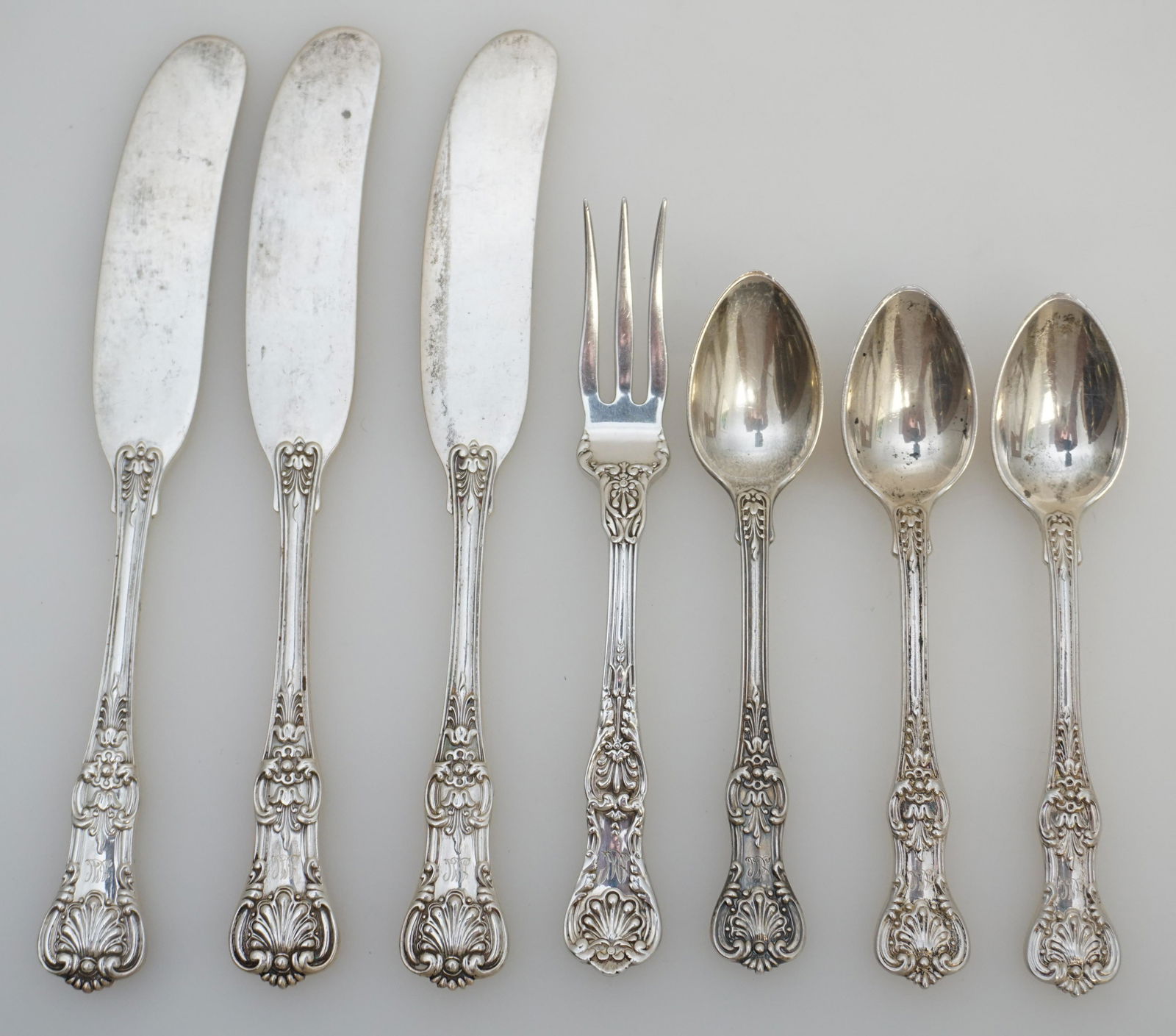 7 PC TIFFANY STERLING SILVER ENGLISH KING: All are Tiffany Sterling Silver English King 1885. 3 Demitasse Spoons 4". 3 Butter Spreaders 5 3/4". 1 Strawberry Fork 4 1/2". All are monogrammed. Approximate weight on all 170 grams. PROVENANCE: A P