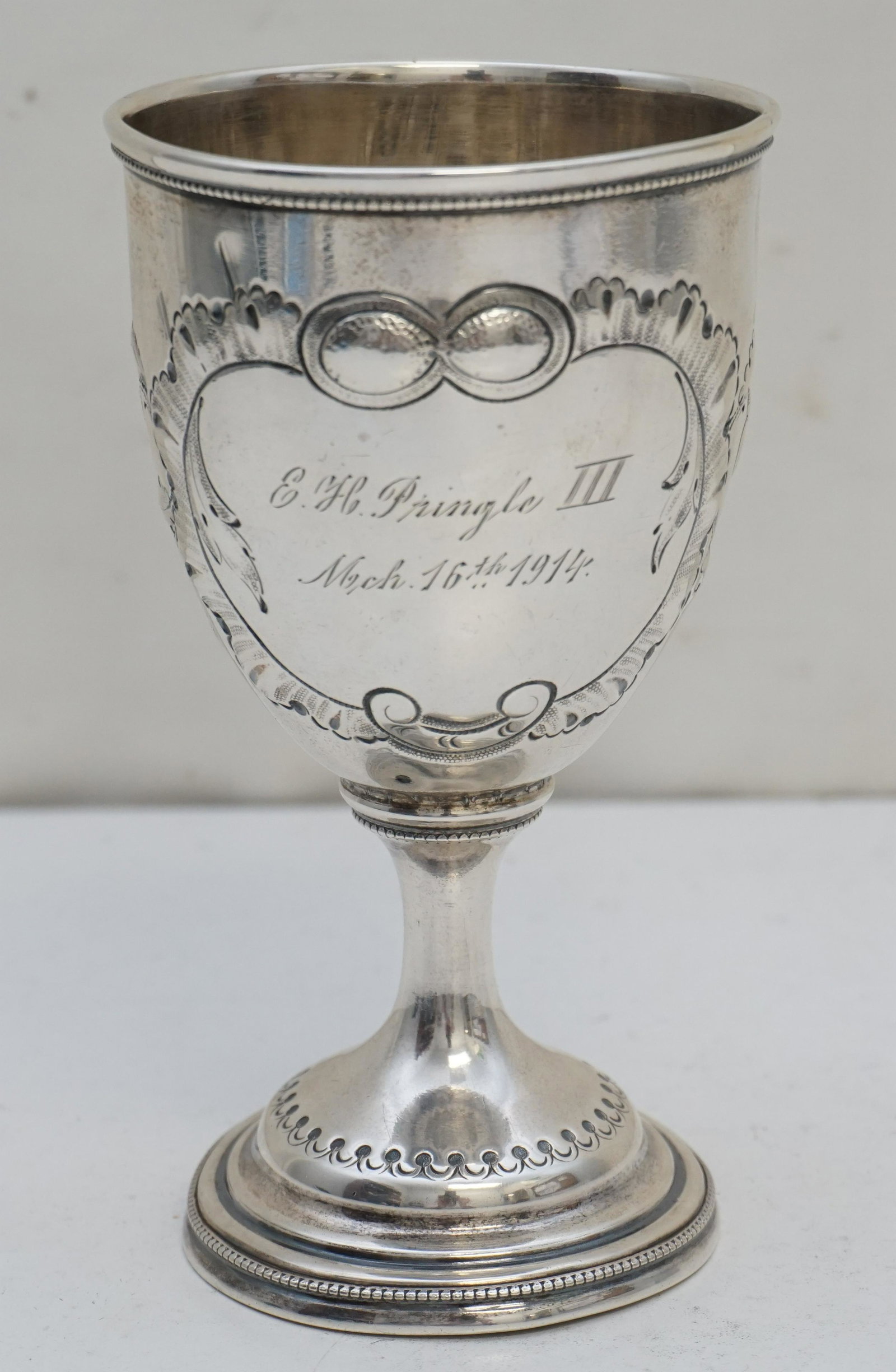 CHARLESTON STERLING COMMUNION SACRAMENT CHALICE: Antique Sterling Silver Communion / Sacrament Chalice. Chased with Scrolling Oak Leaves and Acorns. The cup was a gift to Ernest Henry Pringle III to celebrate his birth March 16, 1914 in Charleston S