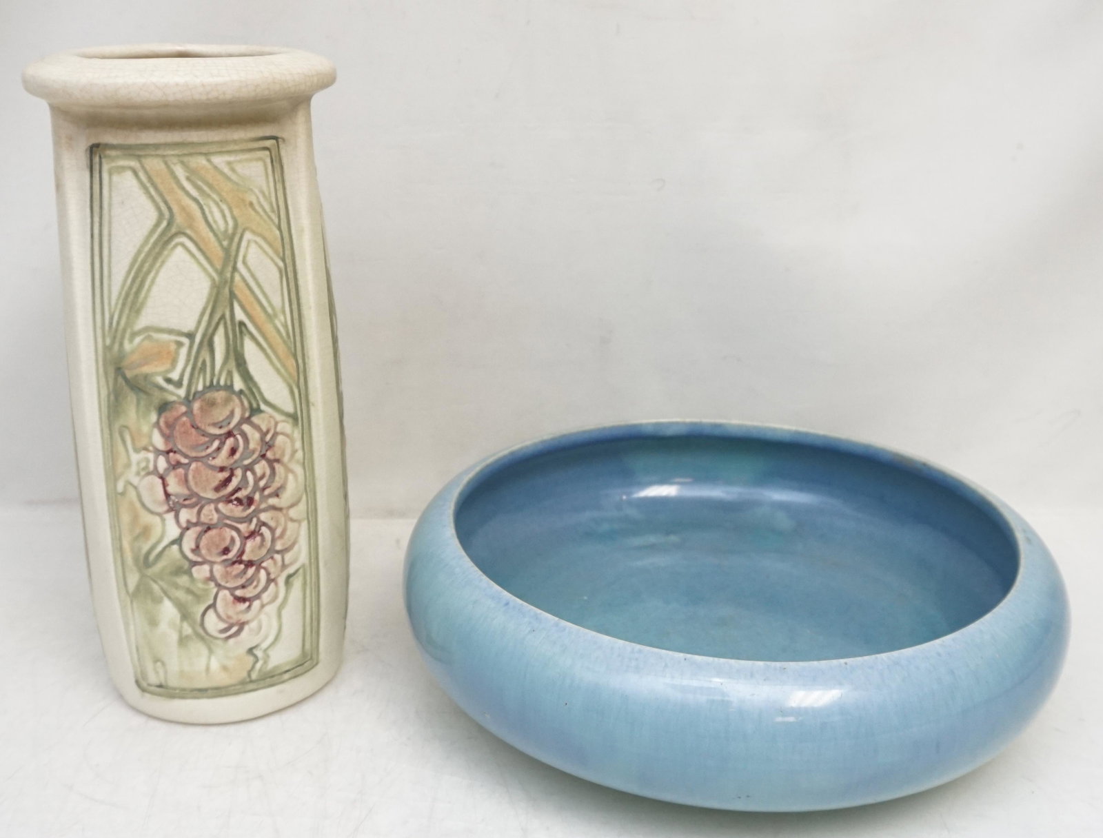 2 pc WELLER POTTERY ROMA + BULB/GARDENIA BOWL: 1- Weller American Pottery Vase in the Roma pattern, the squared cylindrical form modeled with three panels of grapes on the vine in low relief in pink, green and cream matte glaze, unsigned.10" high.