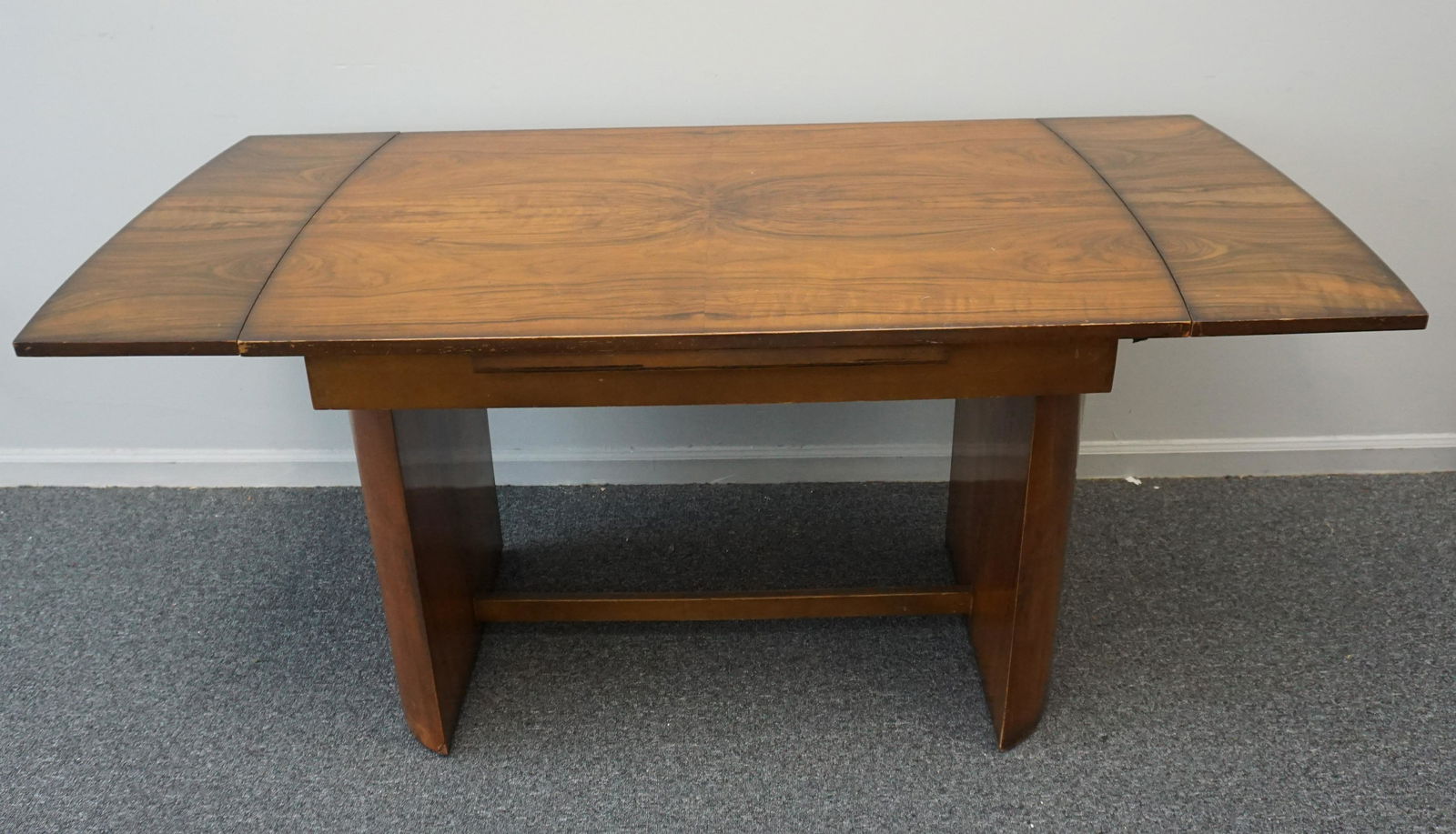 ART DECO DRAW LEAF BREAKFAST TABLE: Art Deco Draw Leaf Breakfast Table raised on curved Pedestal ends. Measures 41 1/2"x30"x30" closed. Each Leaf 10". Extends to 50". PROVENANCE: A Private Charleston SC Estate. ***Pickup only or Shippin