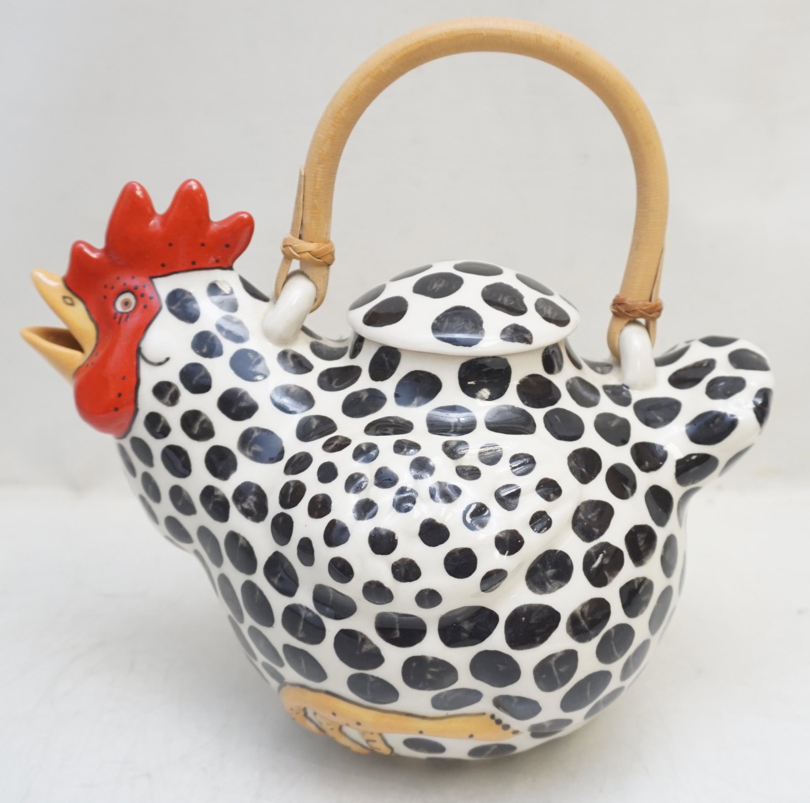 SANTA FE ANIMALS & CO CHICKEN TEAPOT: Vintage Animals & Co.Spotted Chicken Teapot with Bamboo Handle. A handmade ceramic pottery teapot made by Animals & Co. based out of Santa Fe, New Mexico in the 1980â€™s. Measures 9 1/2"x6"x 1/2"