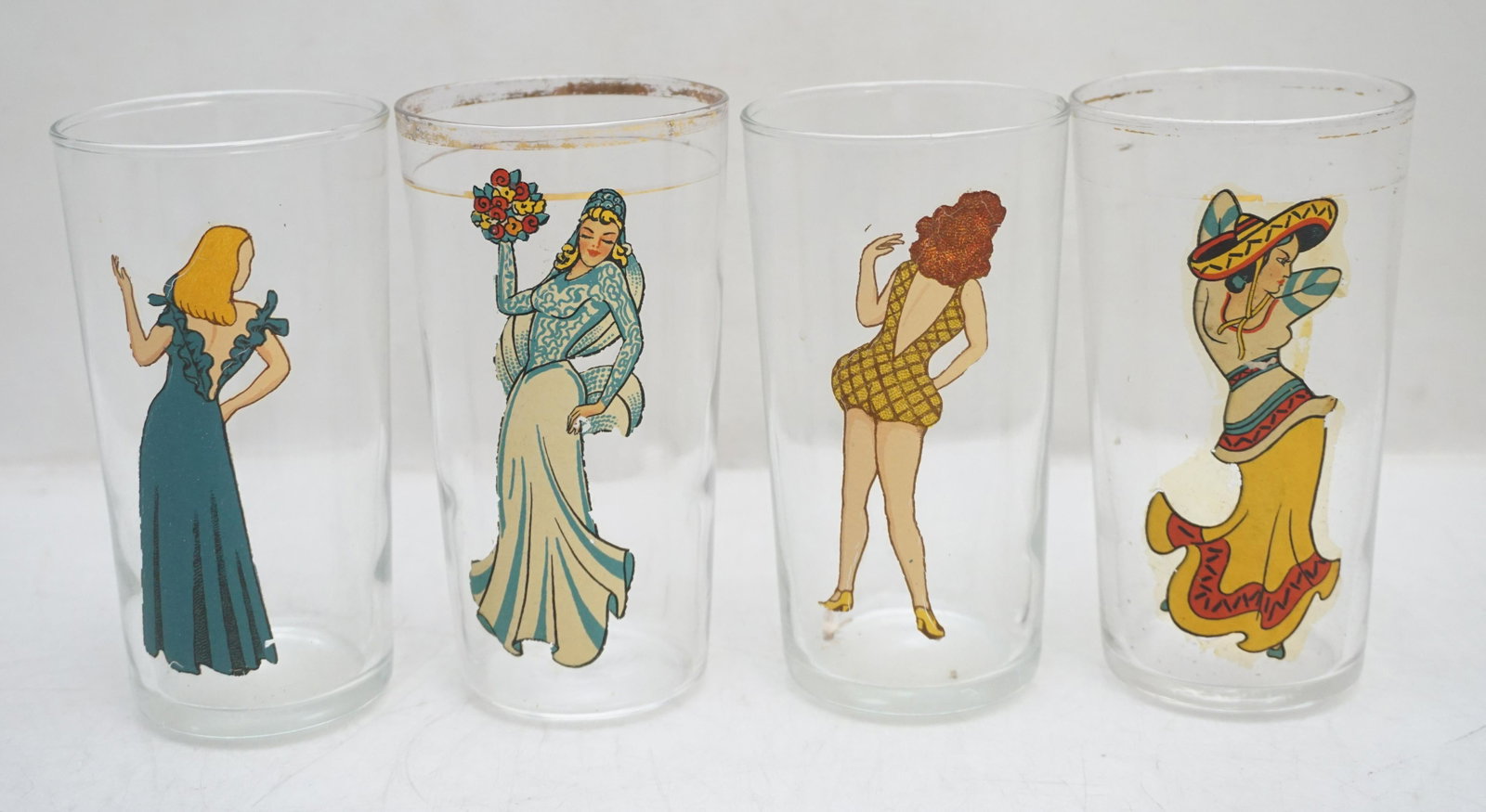 4 NAUGHTY SWANKY GLASSES: 4 Vintage 1940-50 Naughty Nude Risque Bar Glasses 4 3/4". Weight on all 1 pd 4 oz. PROVENANCE: A Charleston SC Private Estate.